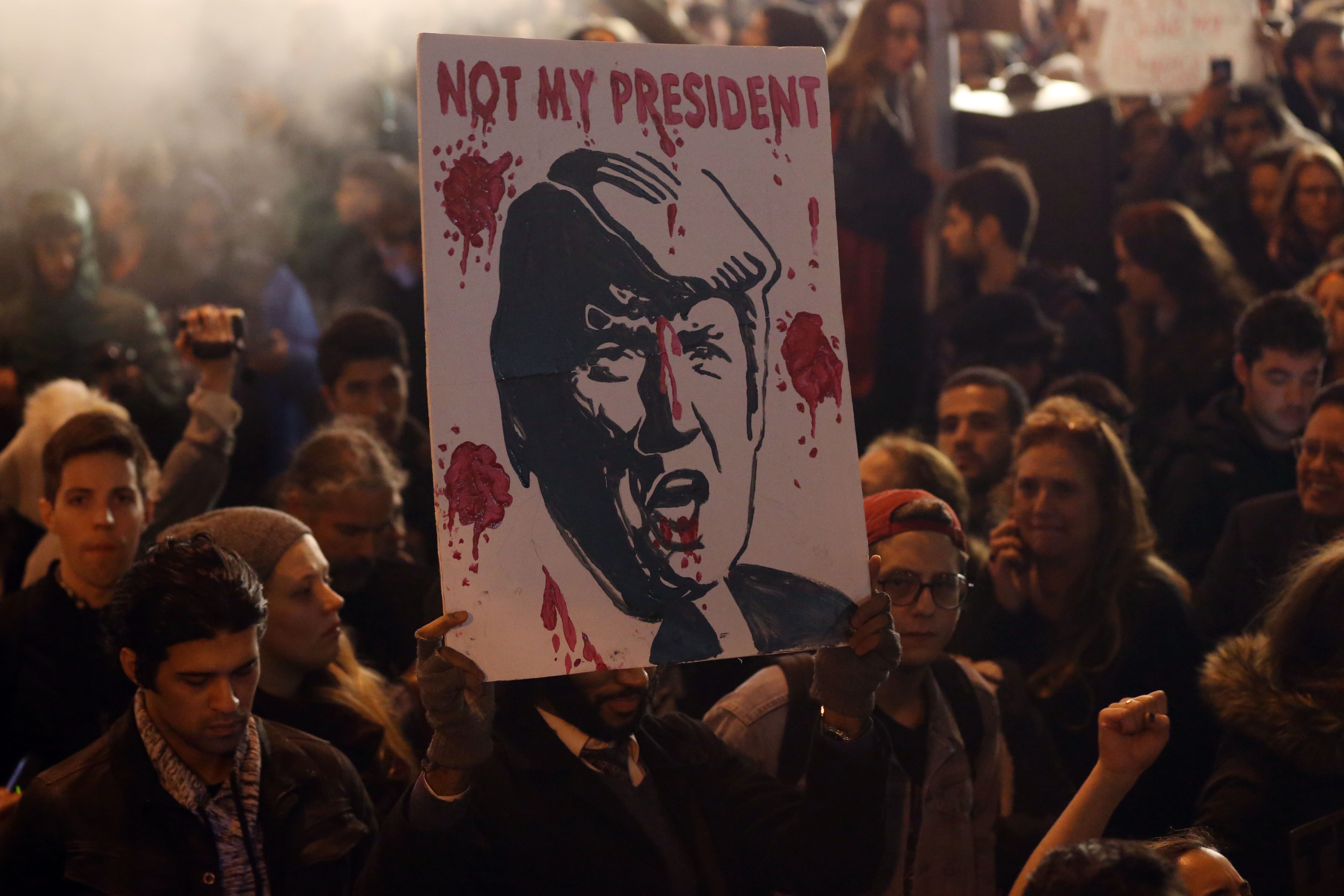 Protestors gather outside Trump Tower during a protest in New York, United States on November 9, 2016.