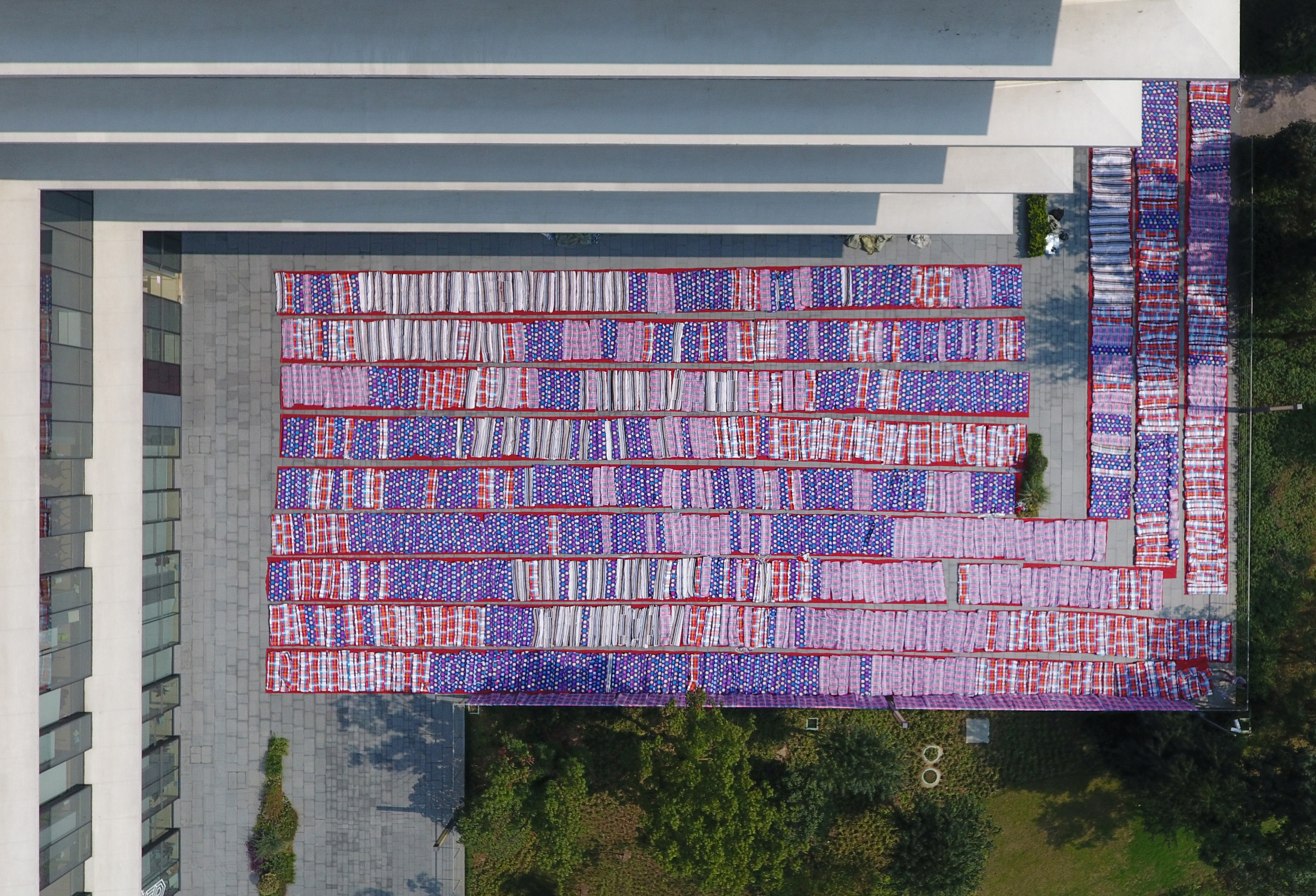 Quilts for Alibaba Group's employees to rest as they prepare for the upcoming 11.11 global shopping festival, also called Singles' Day shopping festival, are dried in a yard of Xixi campus of Alibaba Group in Hangzhou