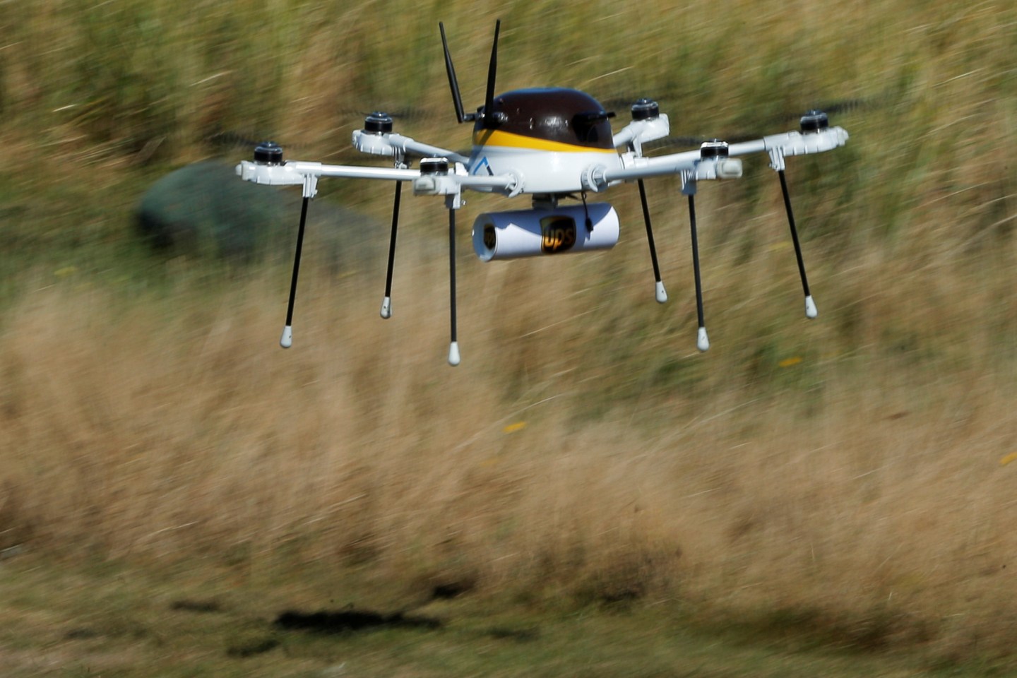 A drone, made by CyPhy Works, carries a UPS package on Children's Island off the coast of Beverly