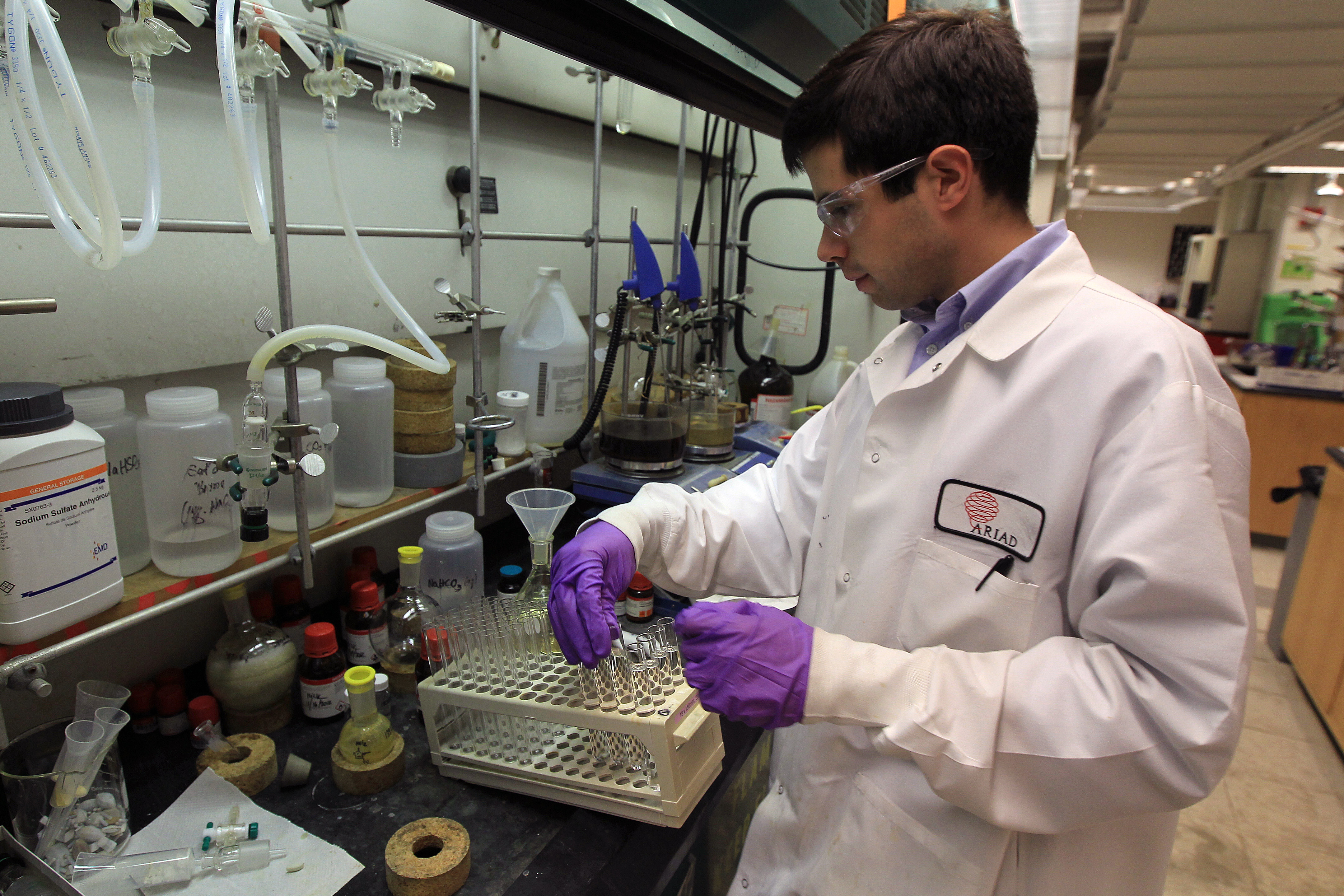 An Ariad Pharmaceuticals chemist working in the company’s lab.