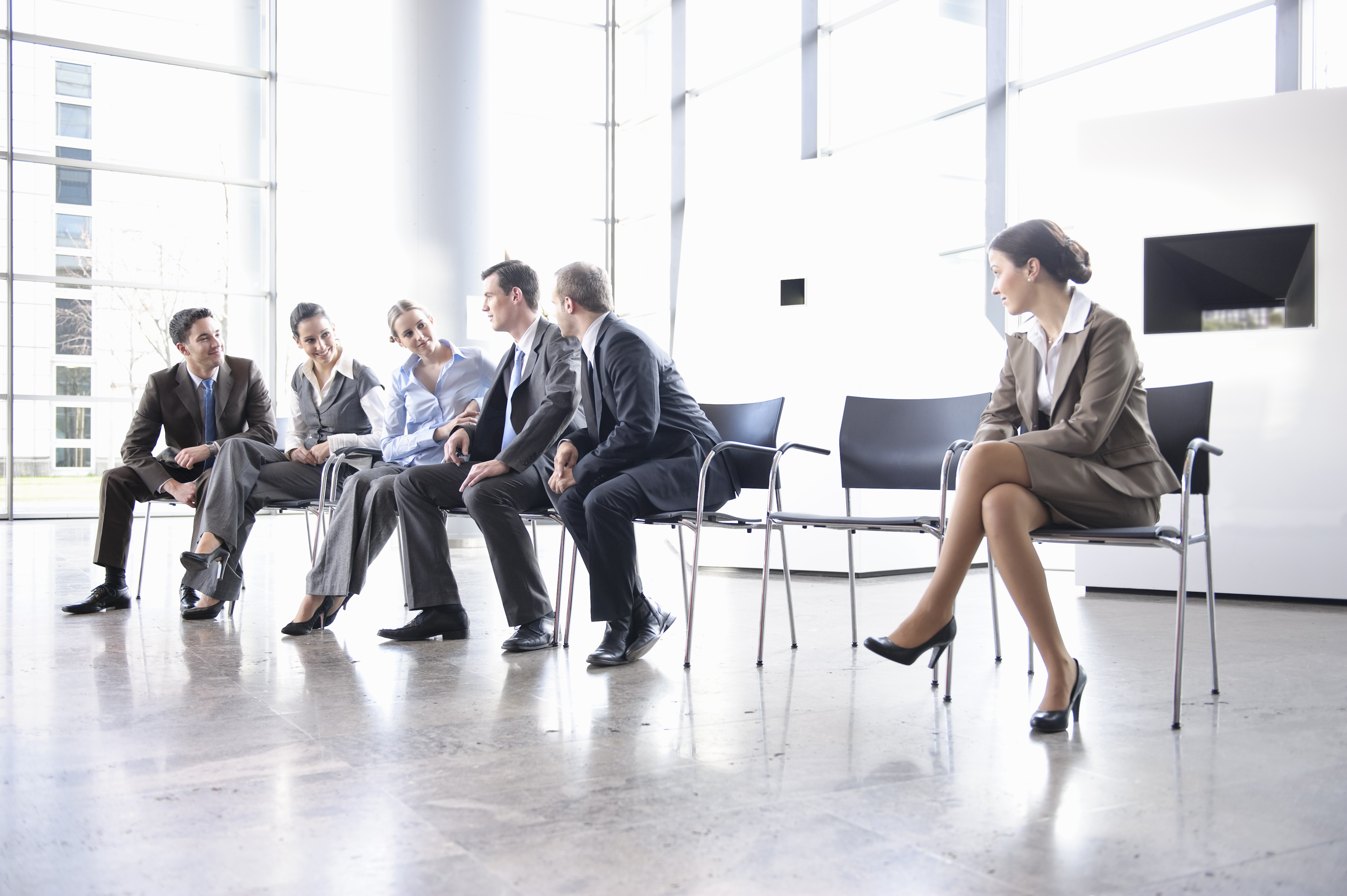 Woman sitting alone separate from group