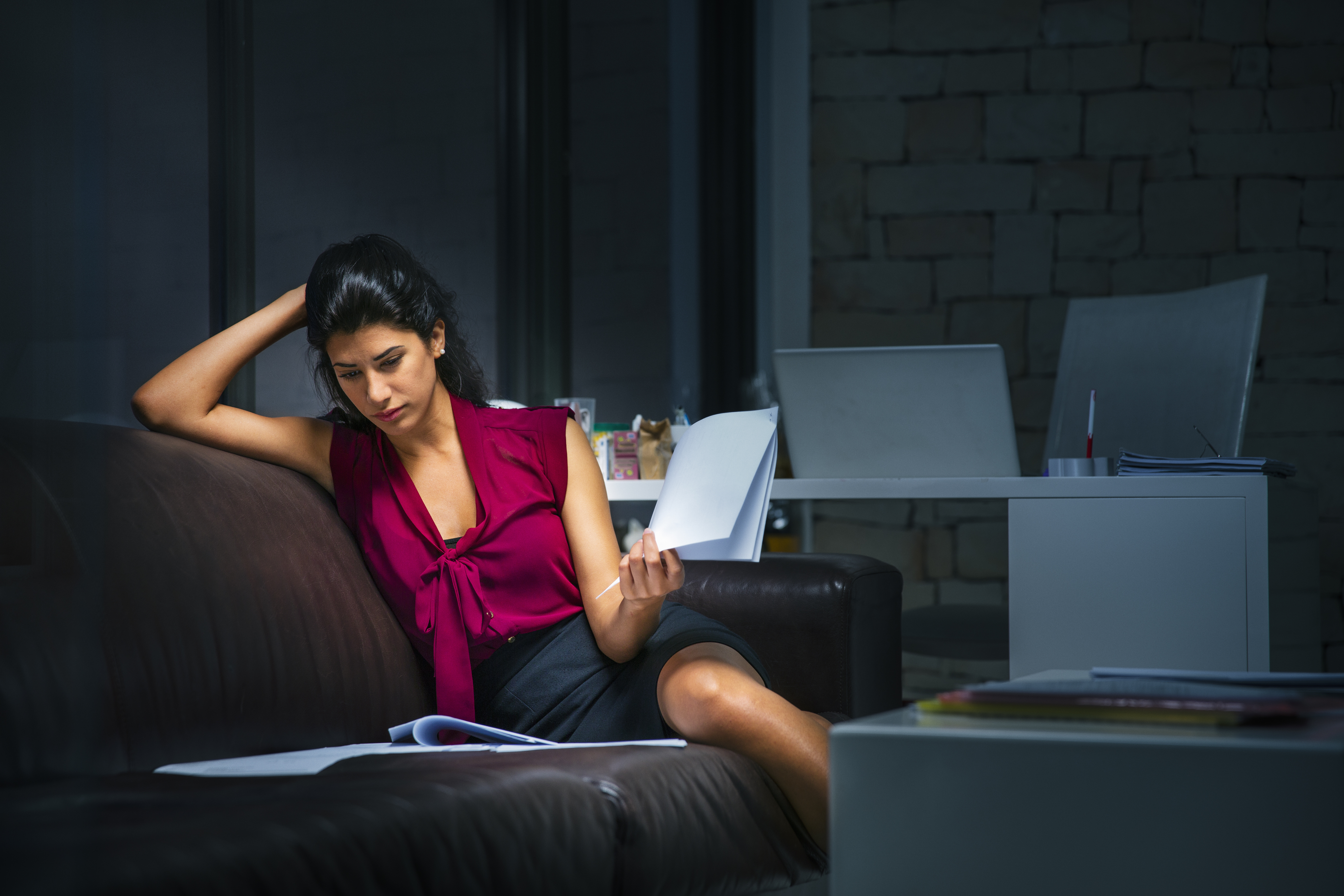 Businesswoman at the office working late.