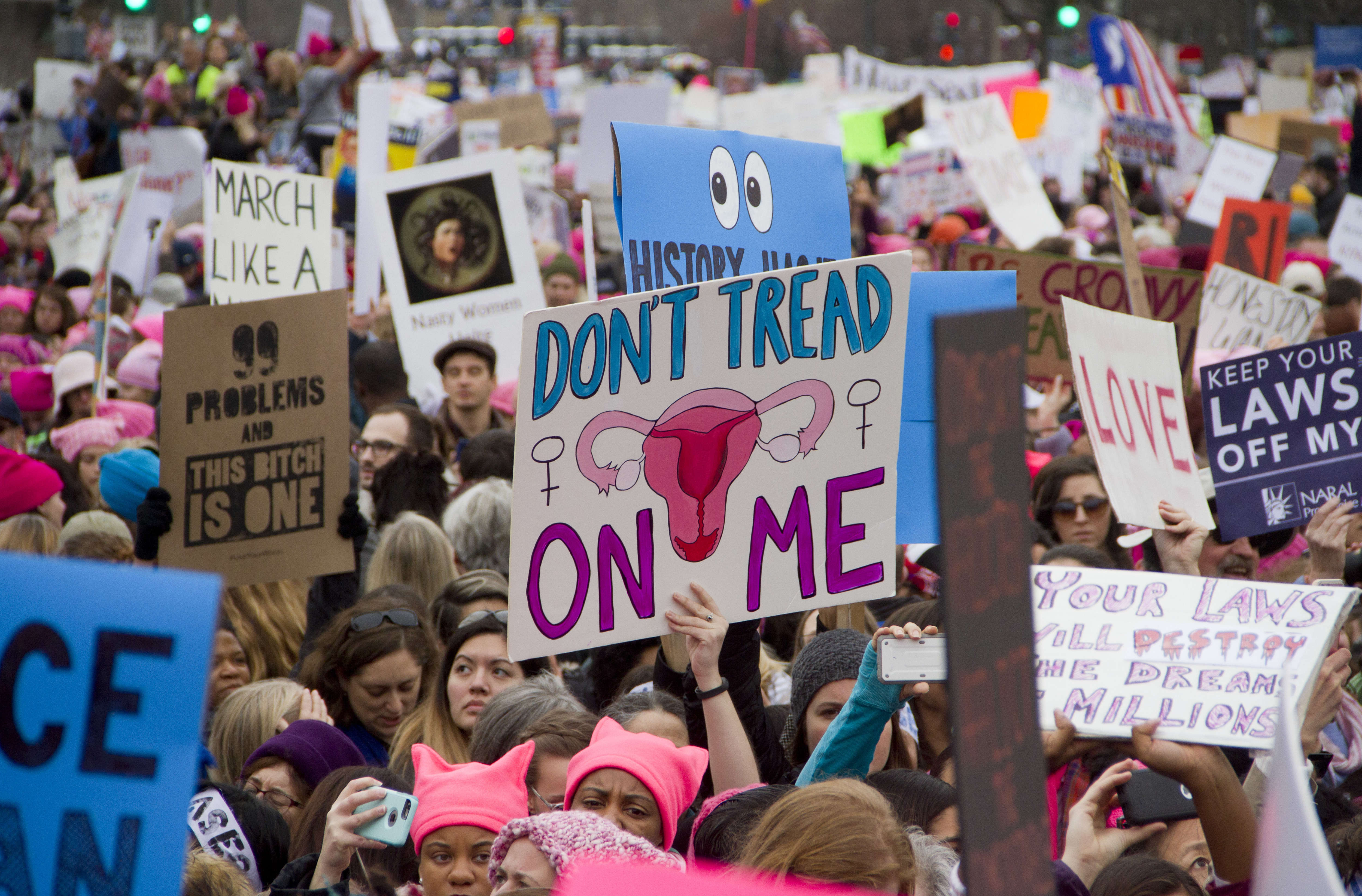 People take part in the Million Woman March one day after