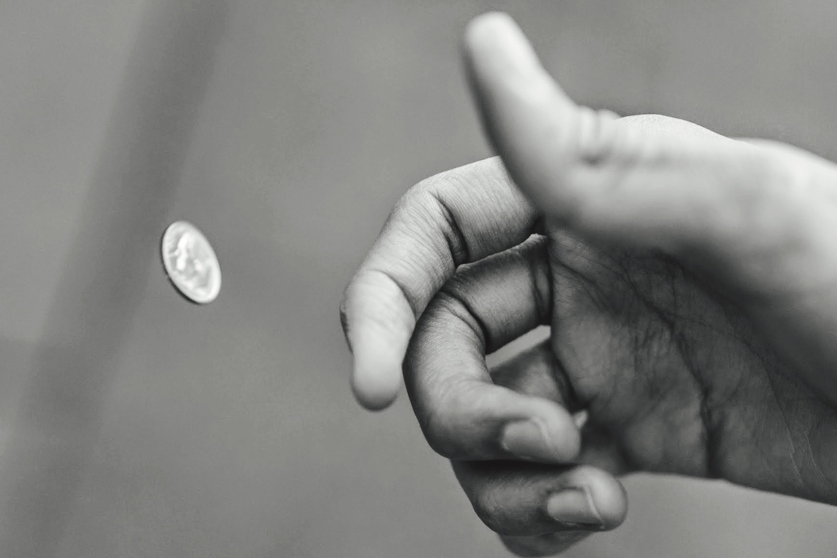Man Flipping Coin