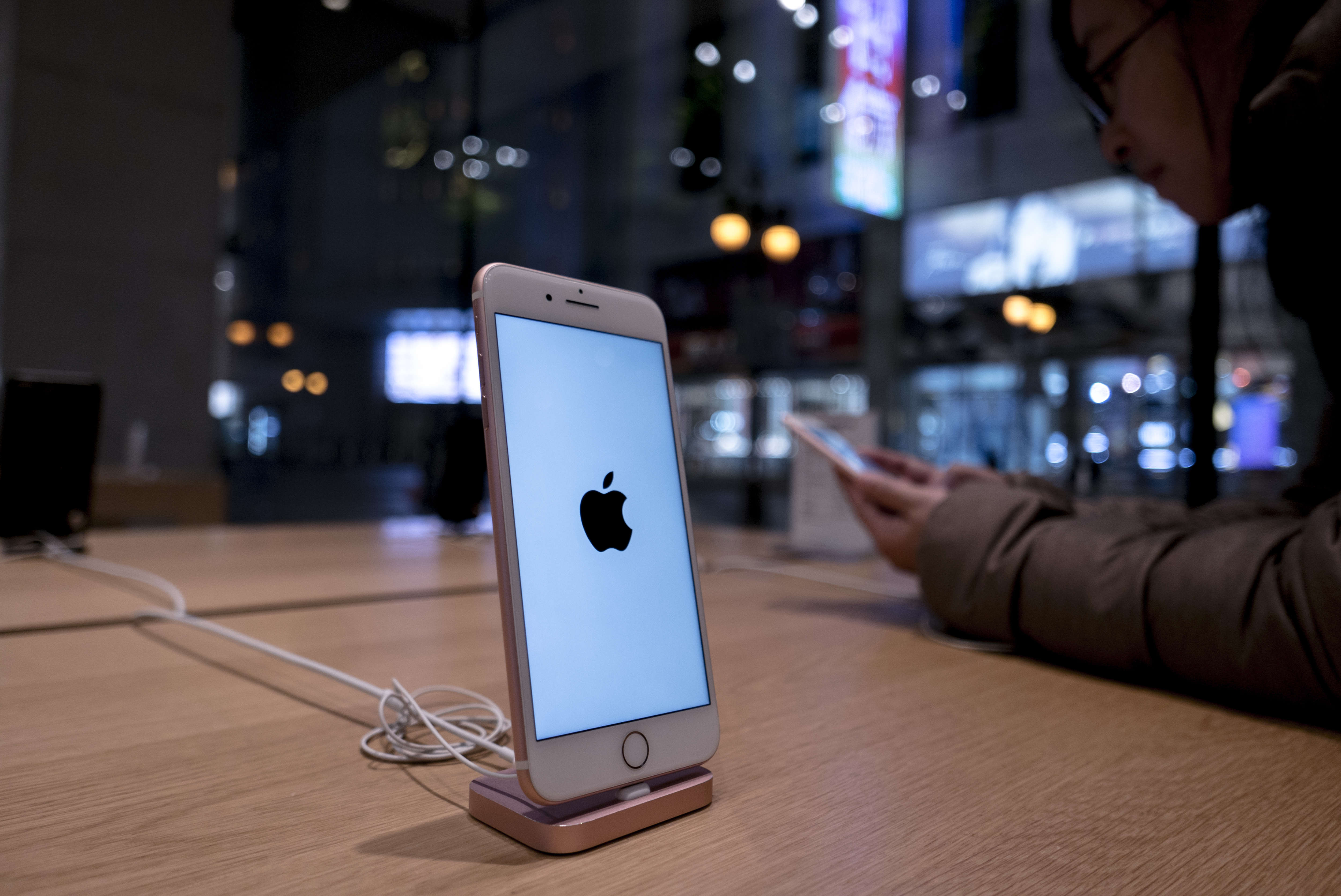 An iPhone 7 is exhibited in an Apple Store.  Because of the