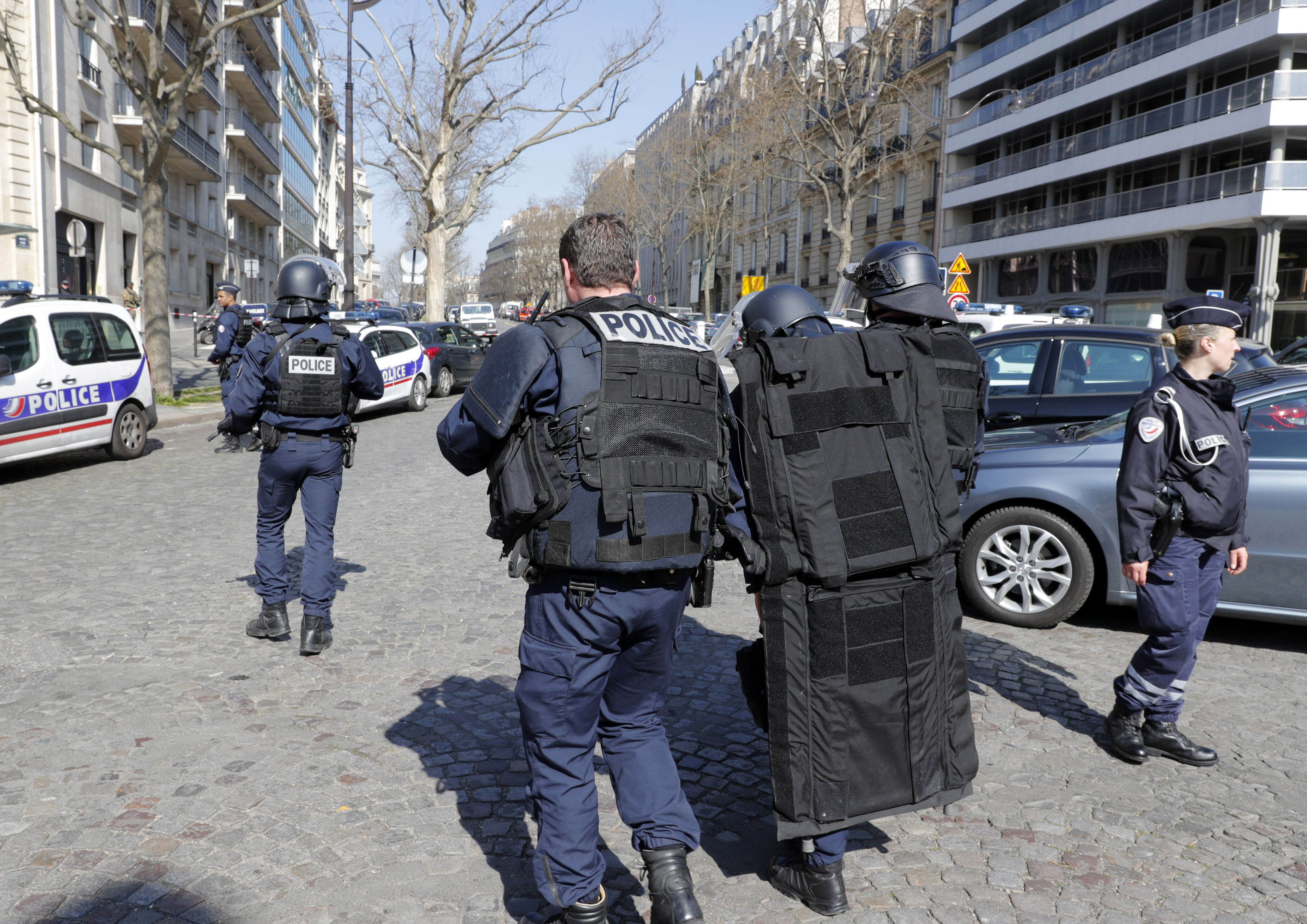 Police outside the International Monetary Fund offices where an envelope exploded in Paris