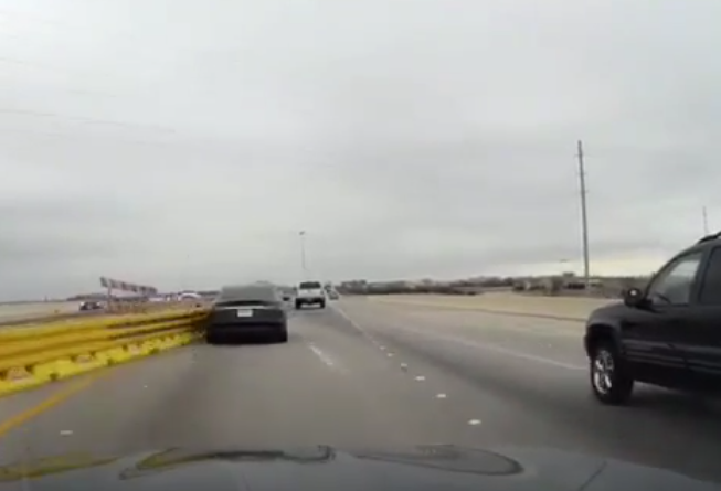 Tesla crashing into road barrier