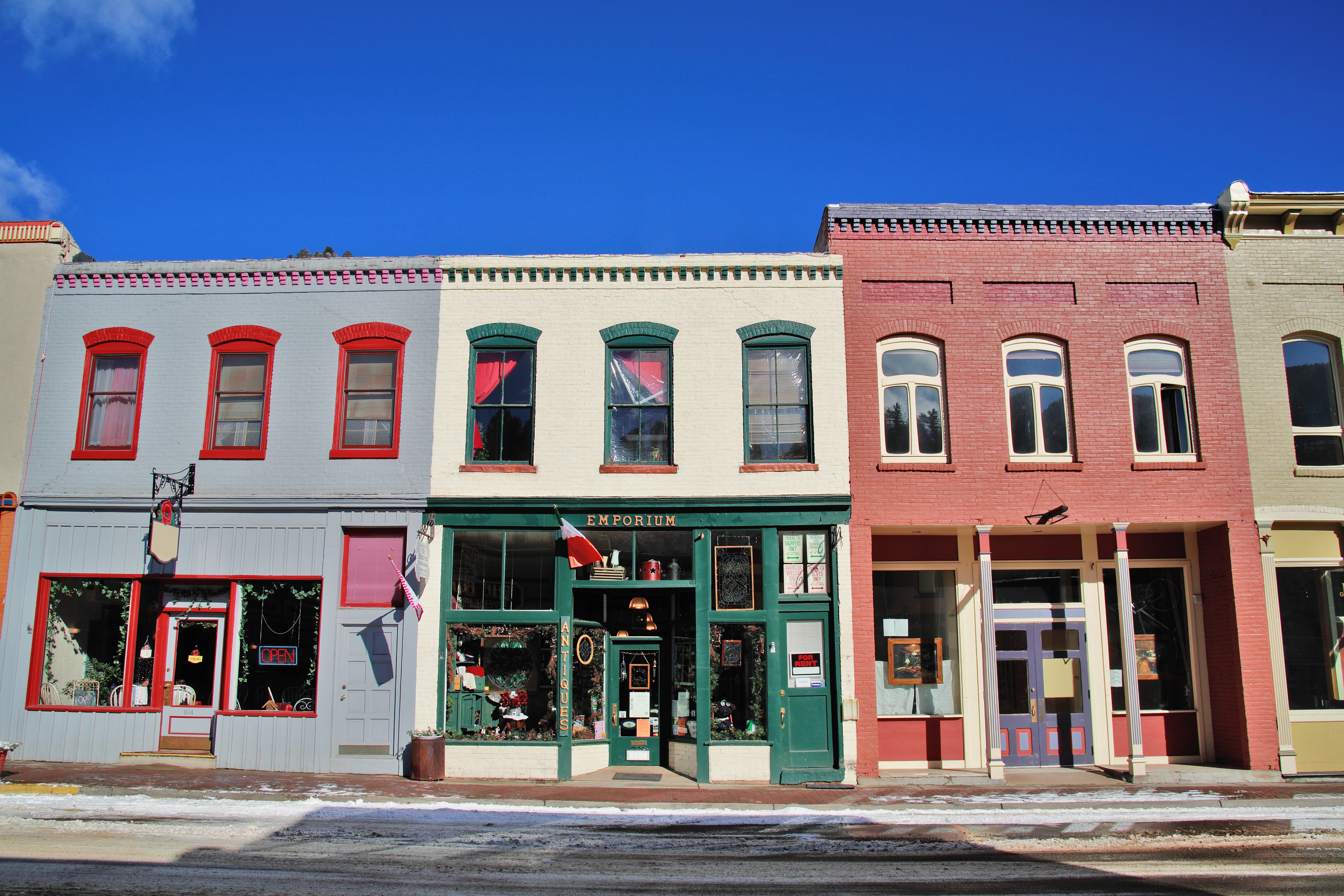 Storefronts along street, winter