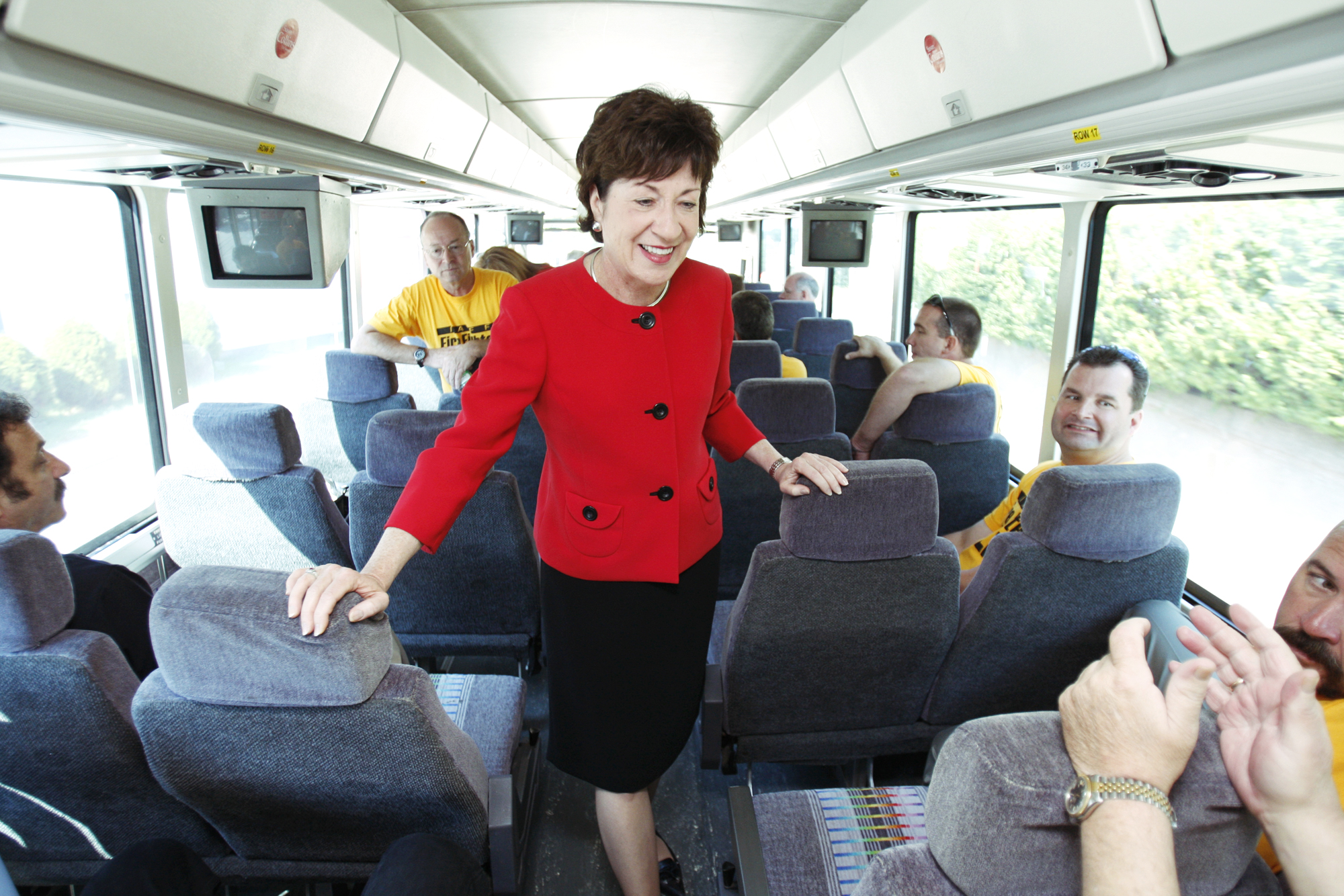 Sen. Susan Collins talks with firefighters while starting the first leg of a tour of fire departmen