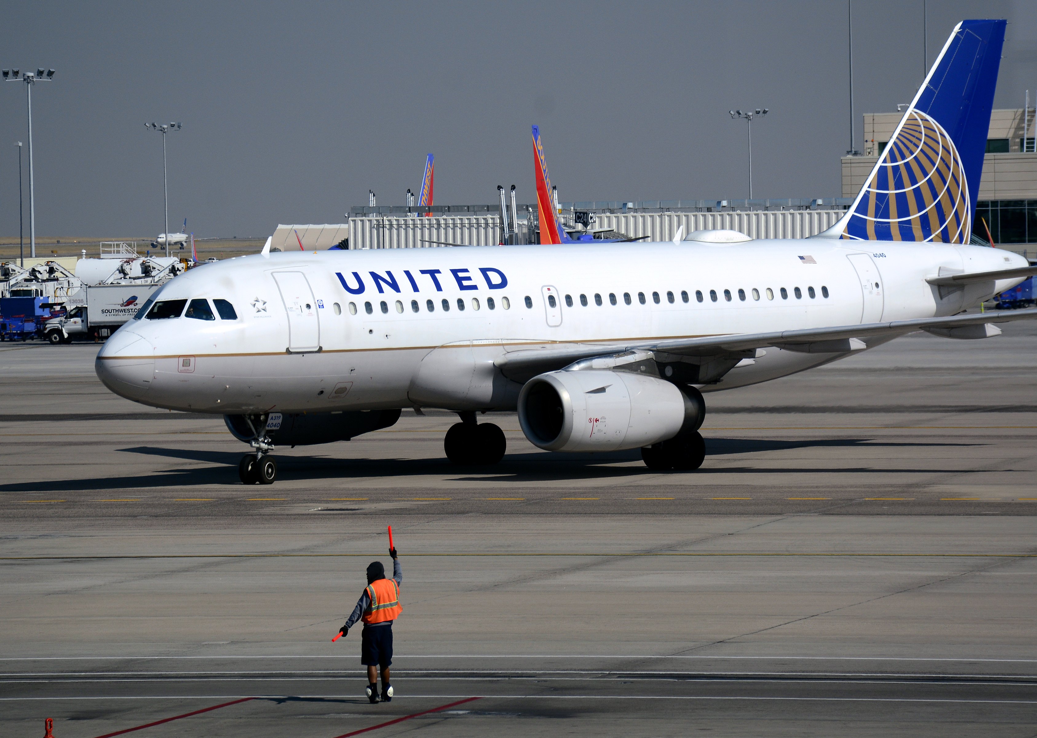 A United Airlines Airbus A319 passenger plane taxis toward a gate at Denver International Airport in Denver, Colorado.