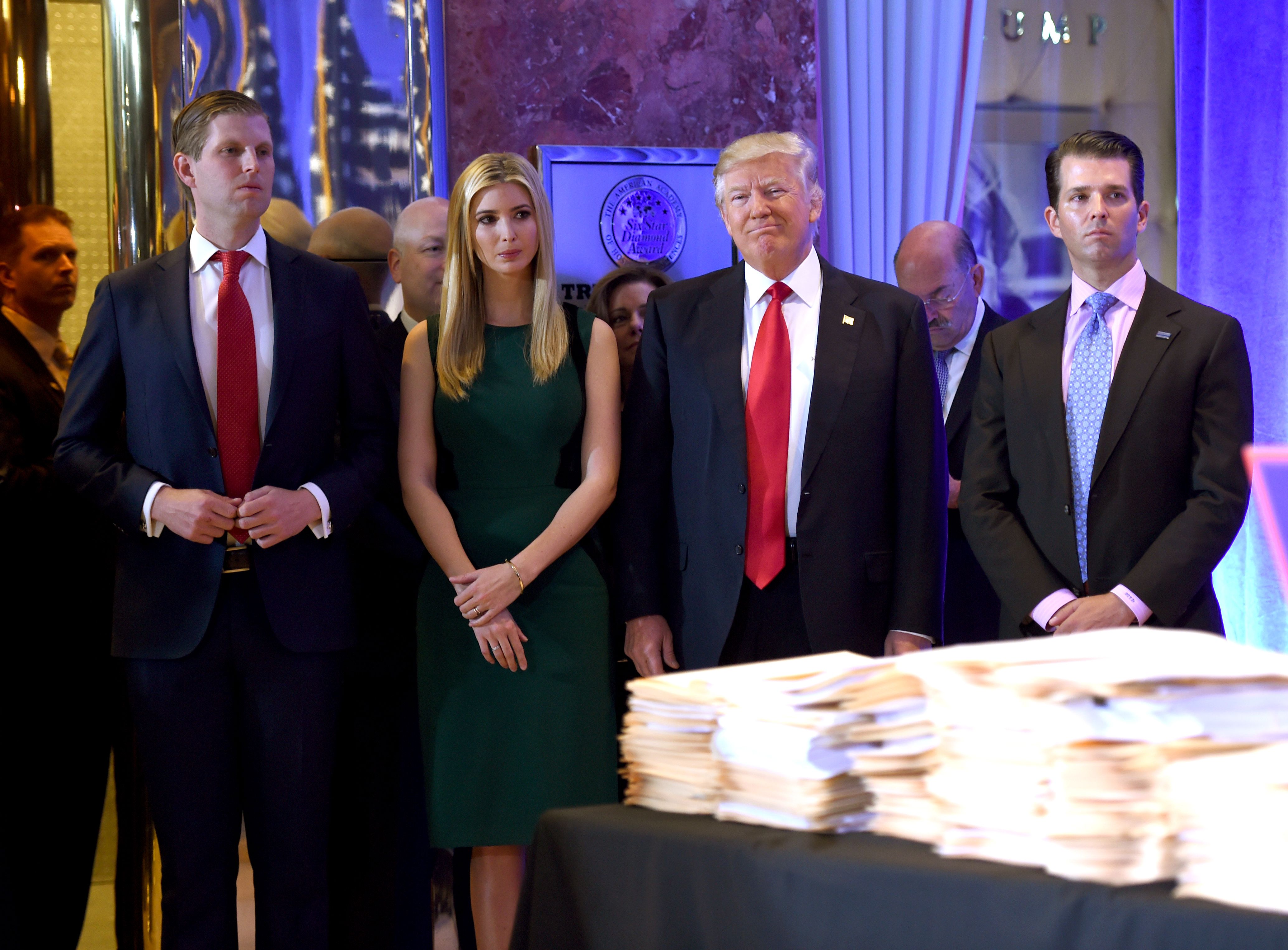 Donald Trump and his children (l-r) Eric, Ivanka, and Donald Jr. days before his January inauguration