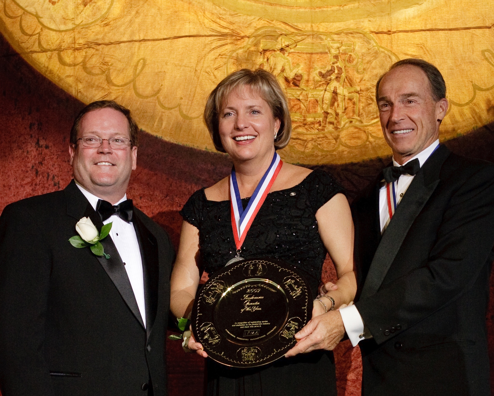 Sally Smith, president and chief executive of Buffalo Wild Wings, Inc. accepts the International Foodservice Manufacturers Association Gold Plate Award. Photo courtesy of IFMA.