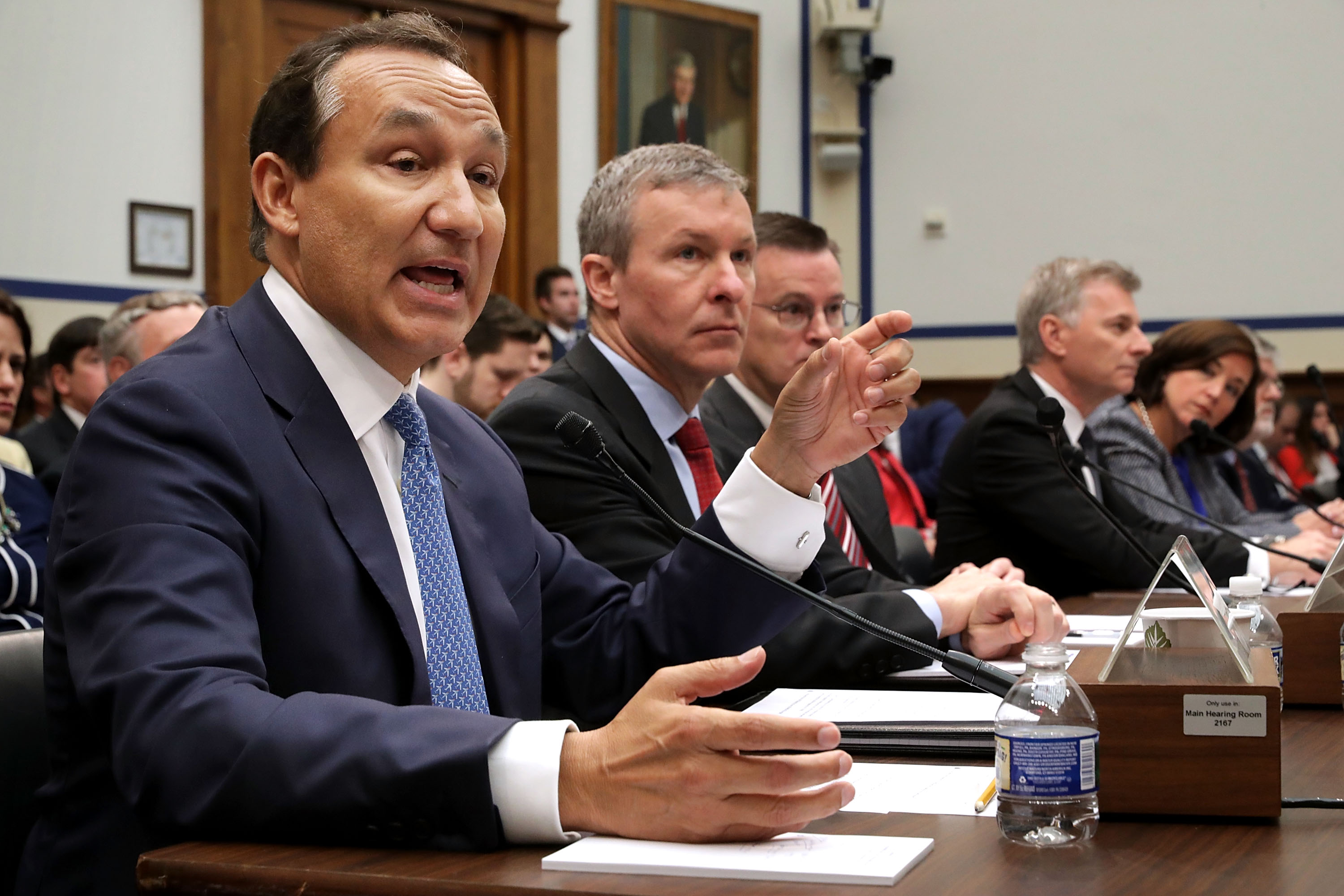 United Airlines CEO Oscar Munoz (left) testifies before the House Transportation and Infrastructure Committee about oversight of U.S. airline customer service.