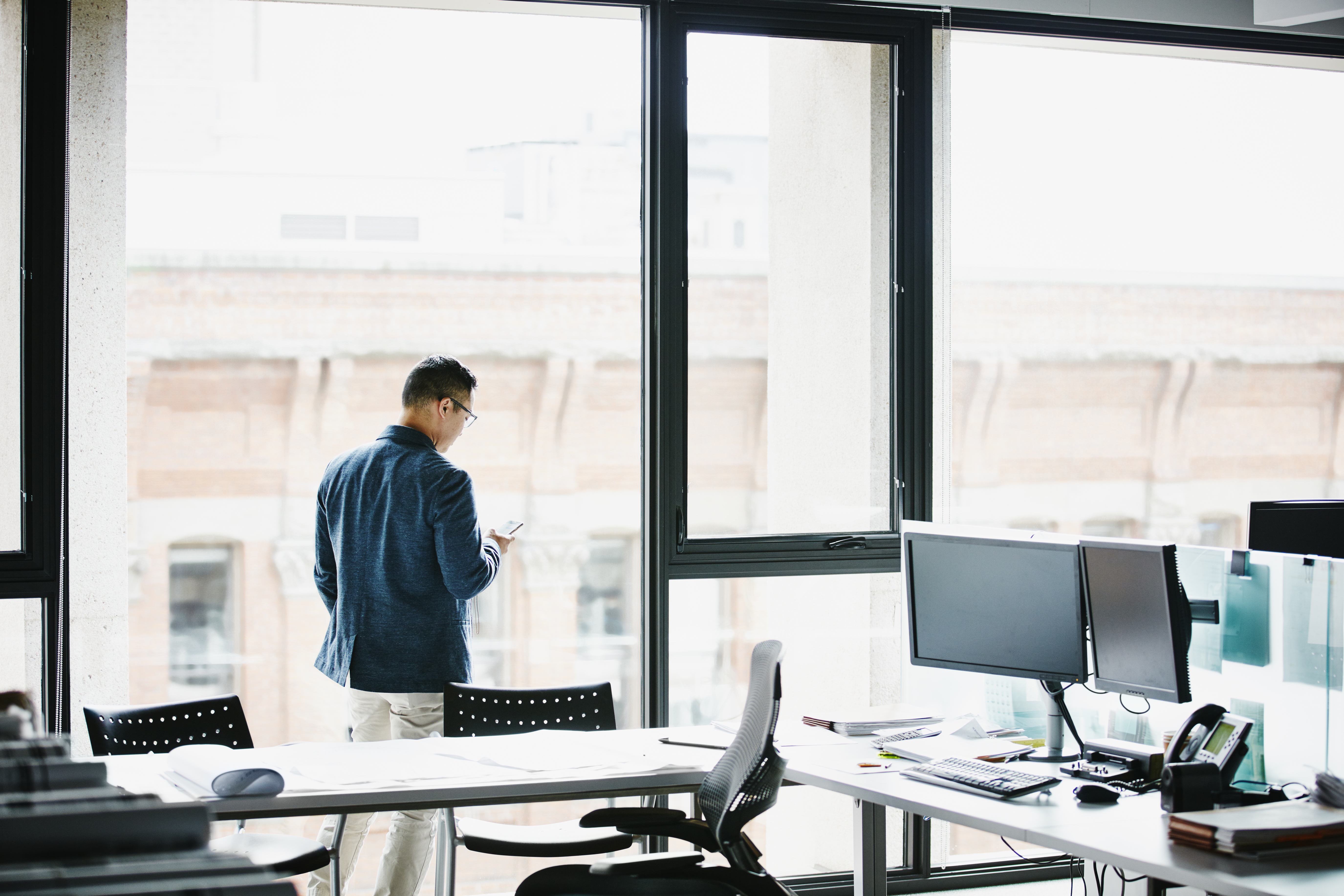 Businessman working on smartphone in office