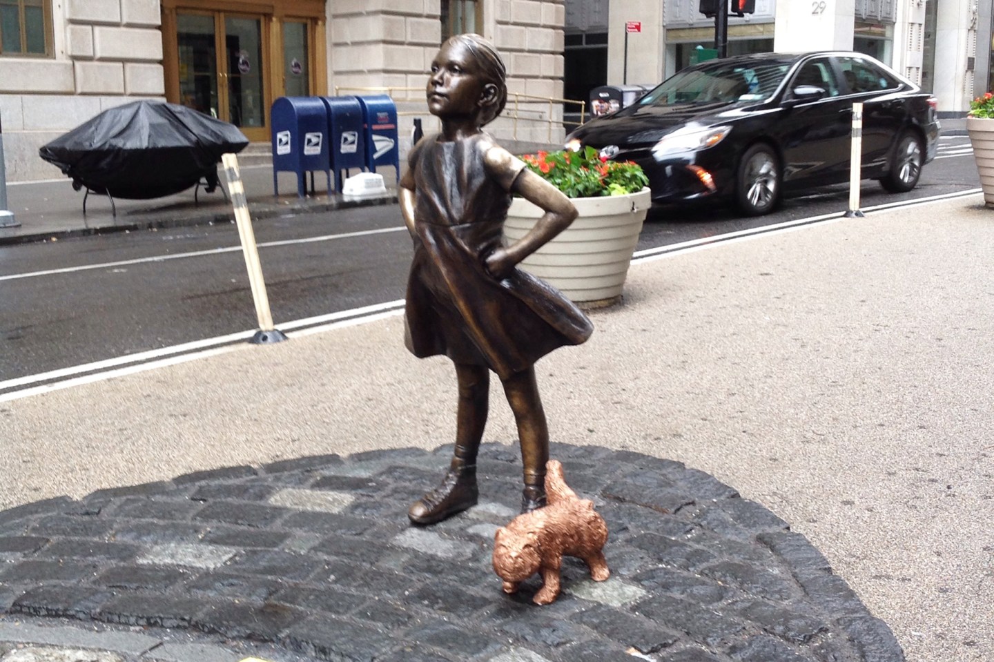 People Are Not Happy About ‘Pissing Pug’ Statue Installed Next to the ‘Fearless Girl’