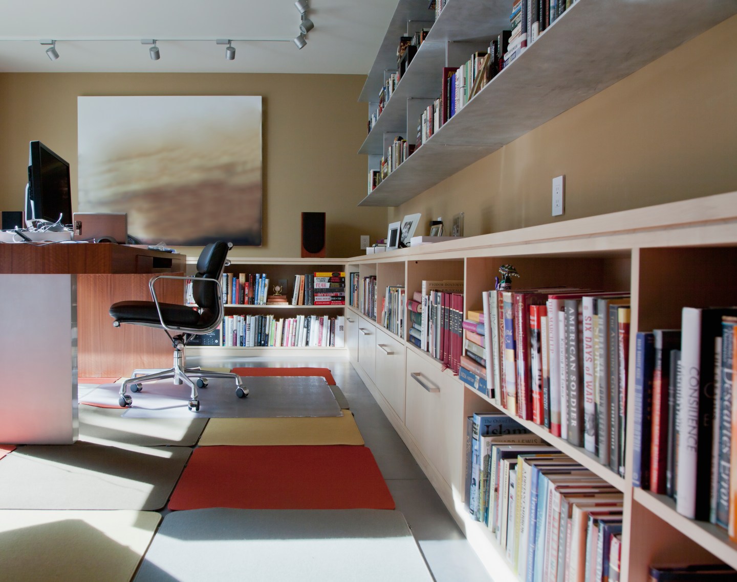 Books lining shelves in home office