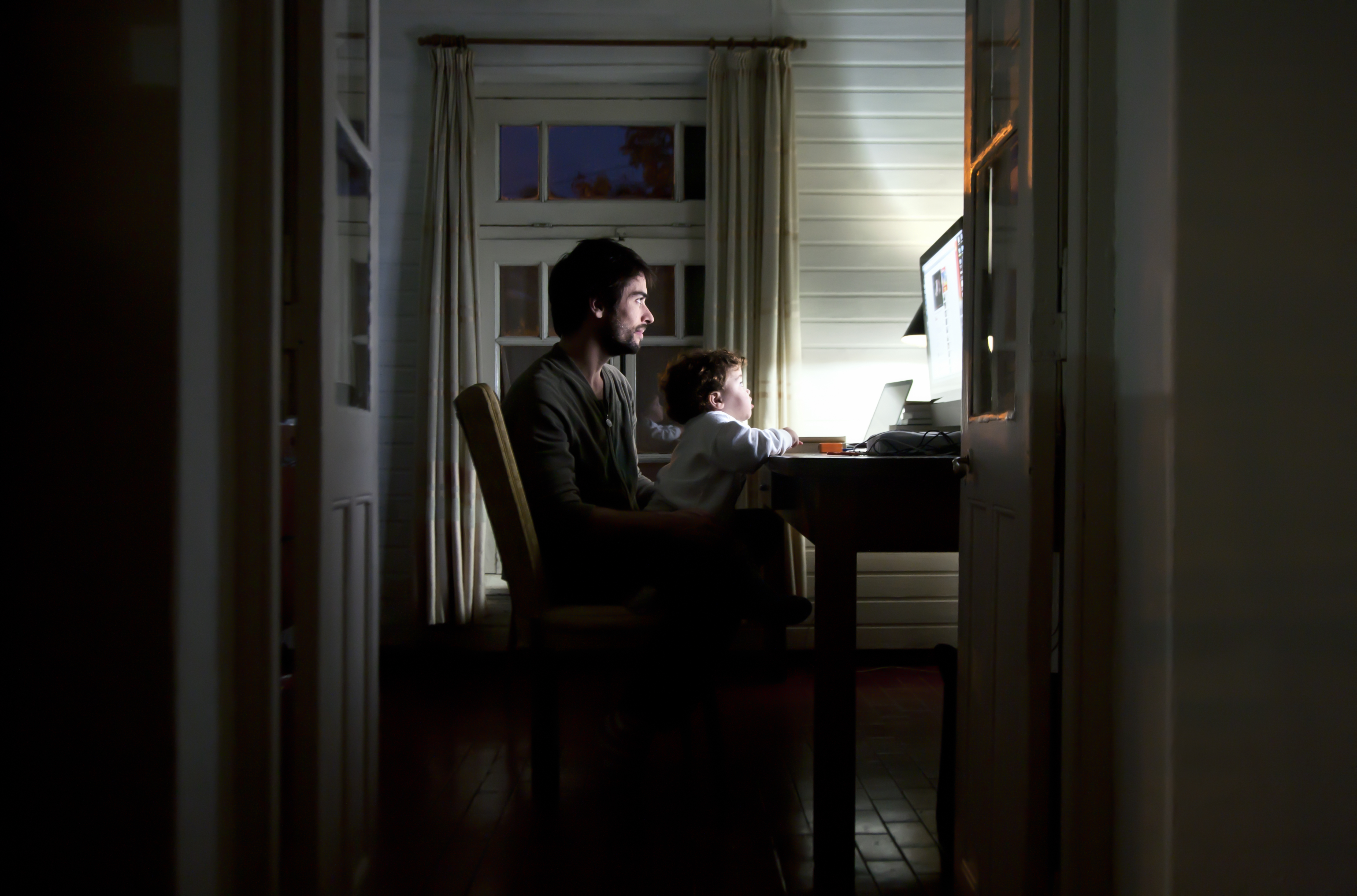 Father and son watching the computer