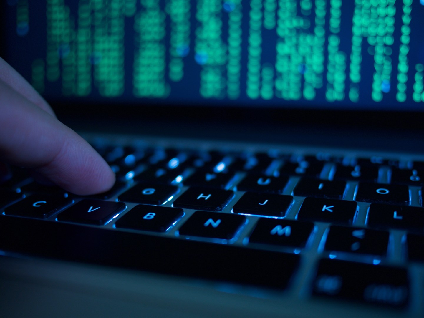 Cropped Hand Of Computer Hacker Typing On Keyboard