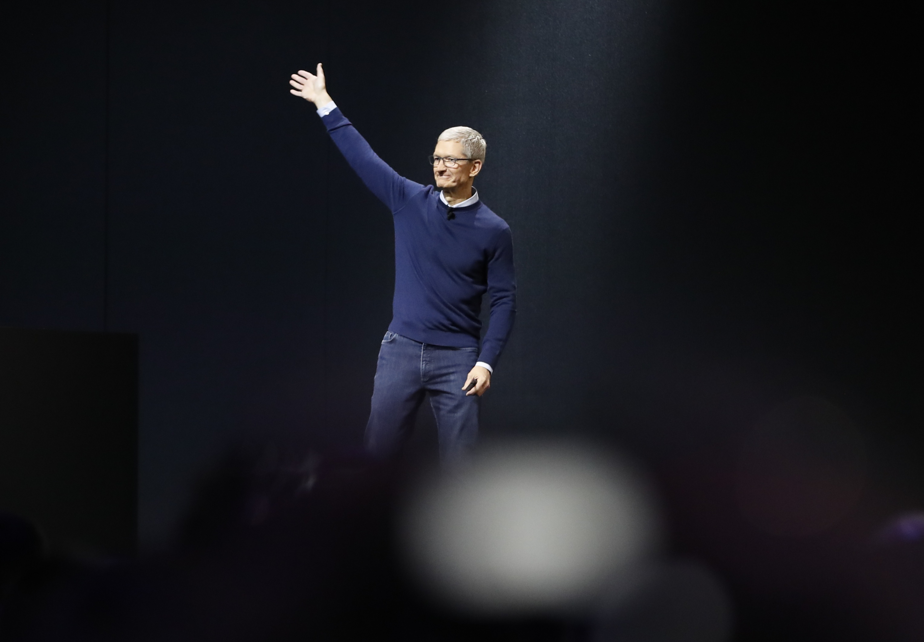 Tim Cook waves during Apple's annual developer conference in San Jose