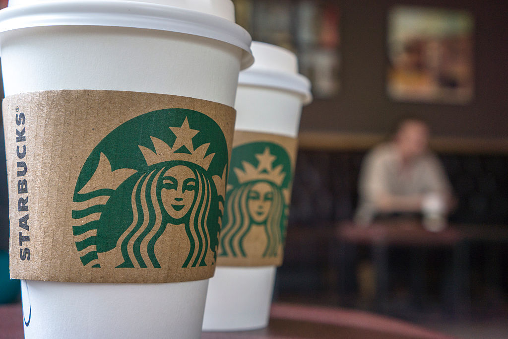 Coffee cups on the table in a Starbucks shop. Last Thursday