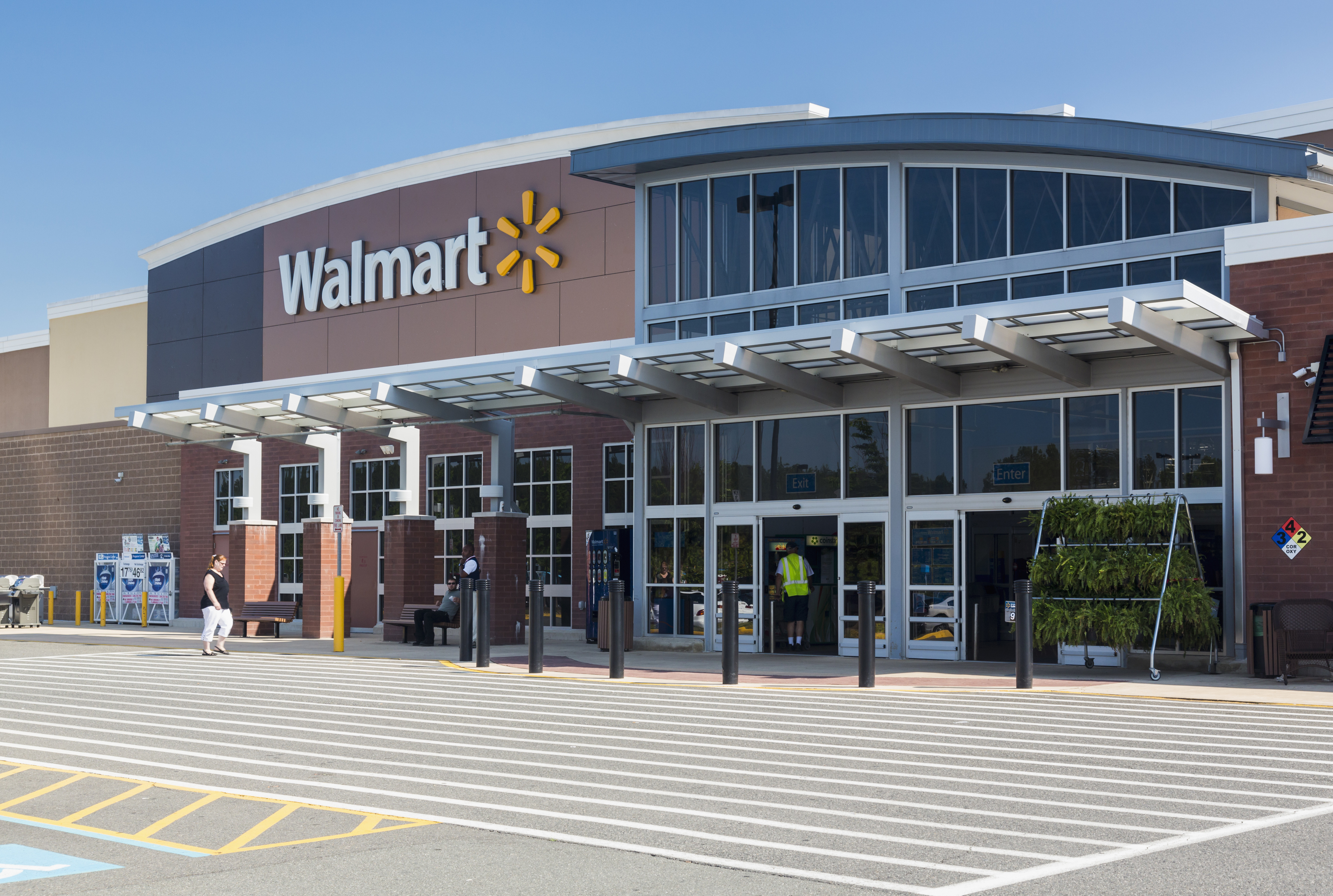 Entrance to large Walmart food supermarket or superstore in Haymarket, Virginia, USA