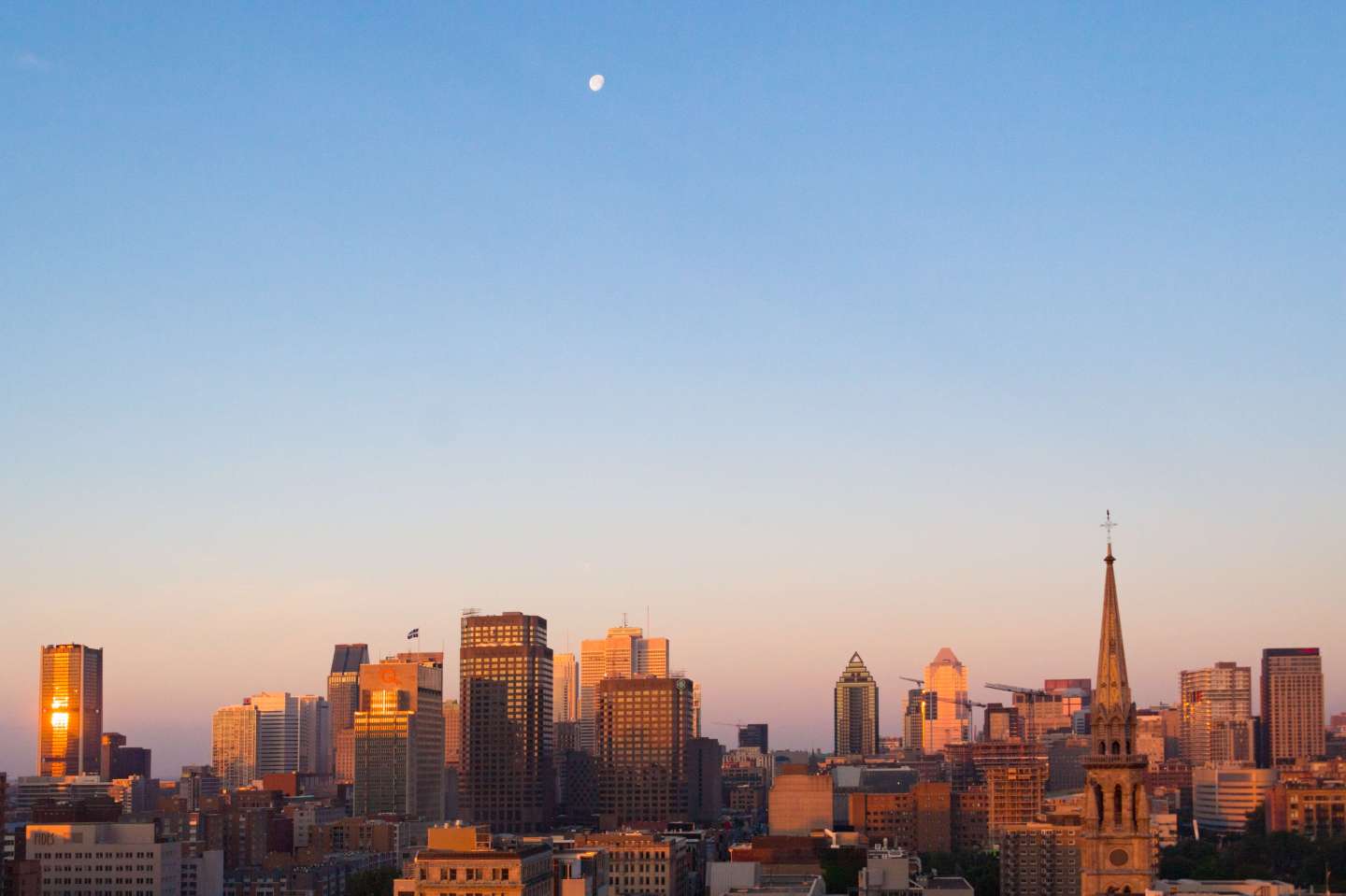 City skyline with moon in the sky. The famous Canadian city