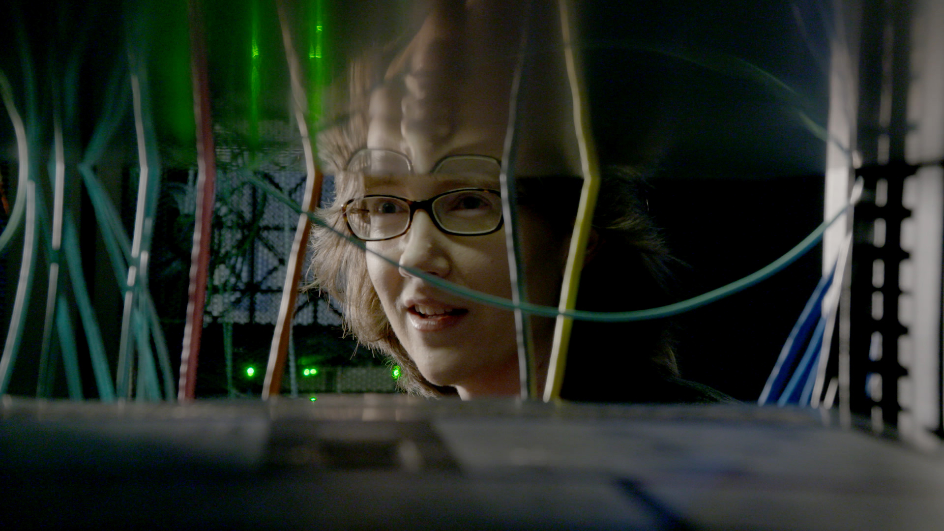 IBM fellow Hillery Hunter reflected in screen of IBM Power System in Yorktown Heights, N.Y.