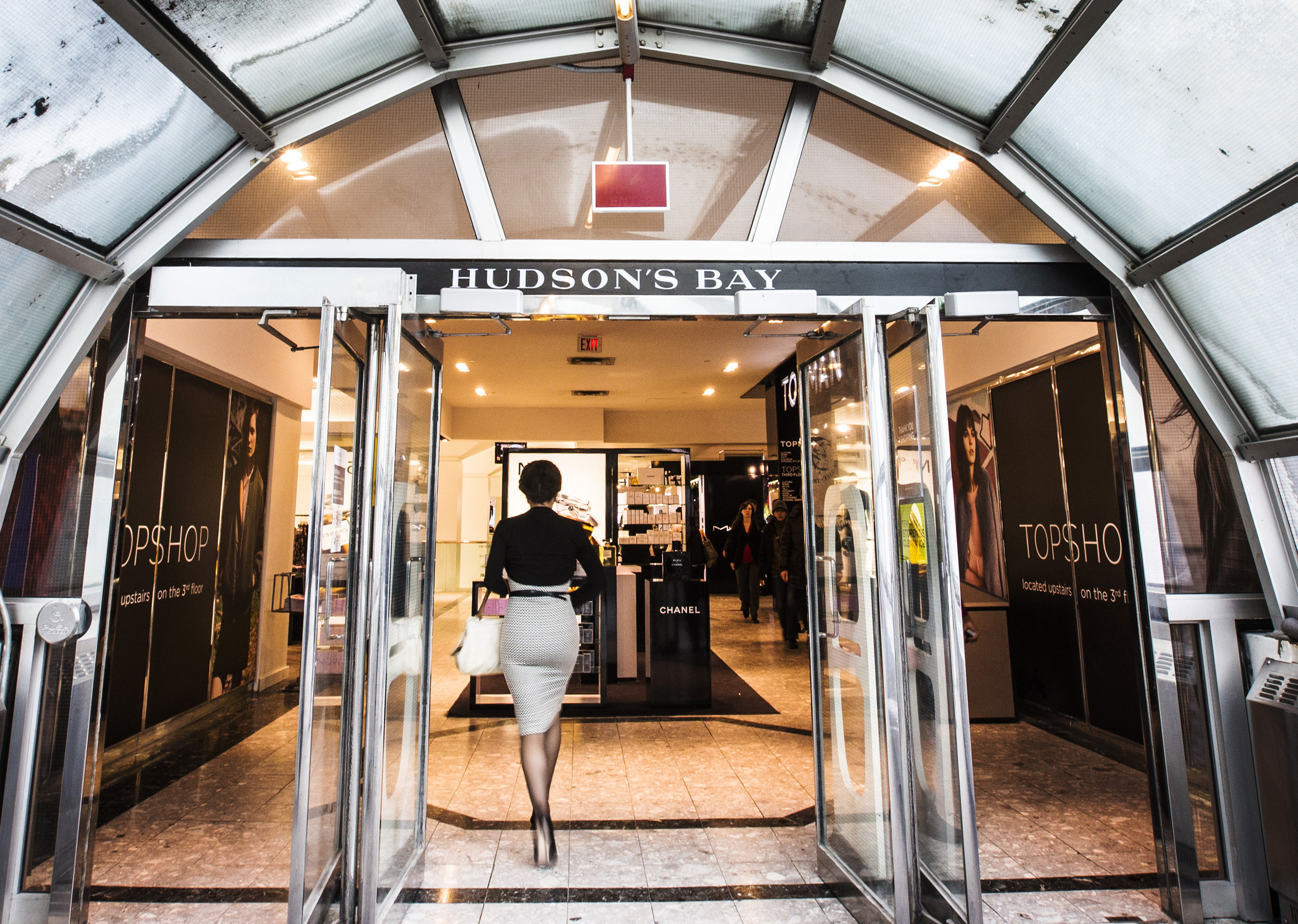 A man walks through the doors at the Hudson's Bay Company (HBC) flagship department store in Toronto
