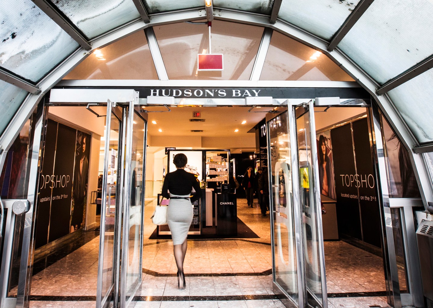 A man walks through the doors at the Hudson's Bay Company (HBC) flagship department store in Toronto