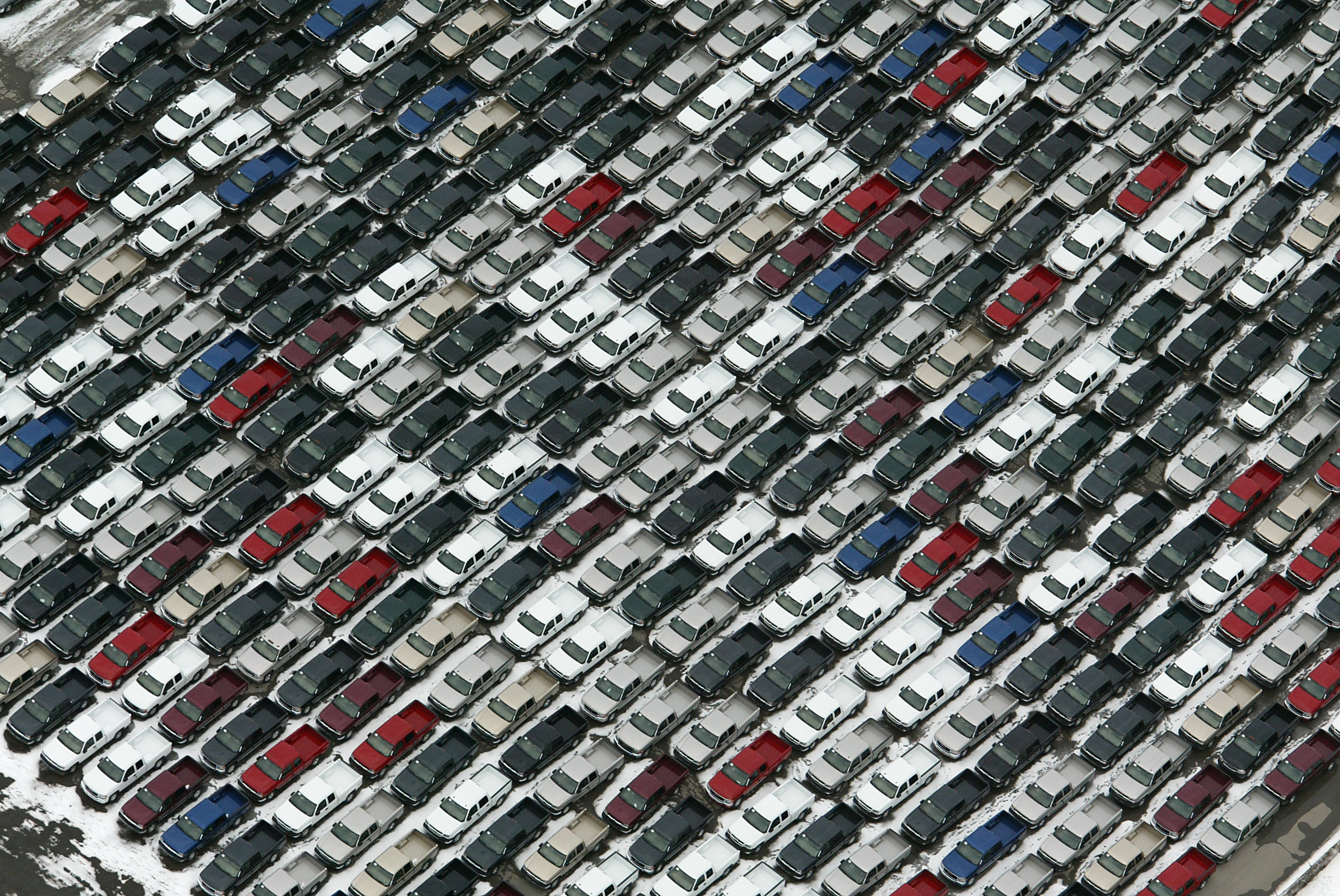 A Sea of new pickup trucks are parkied around GM Oshawa which is filling up with new cars and trucks