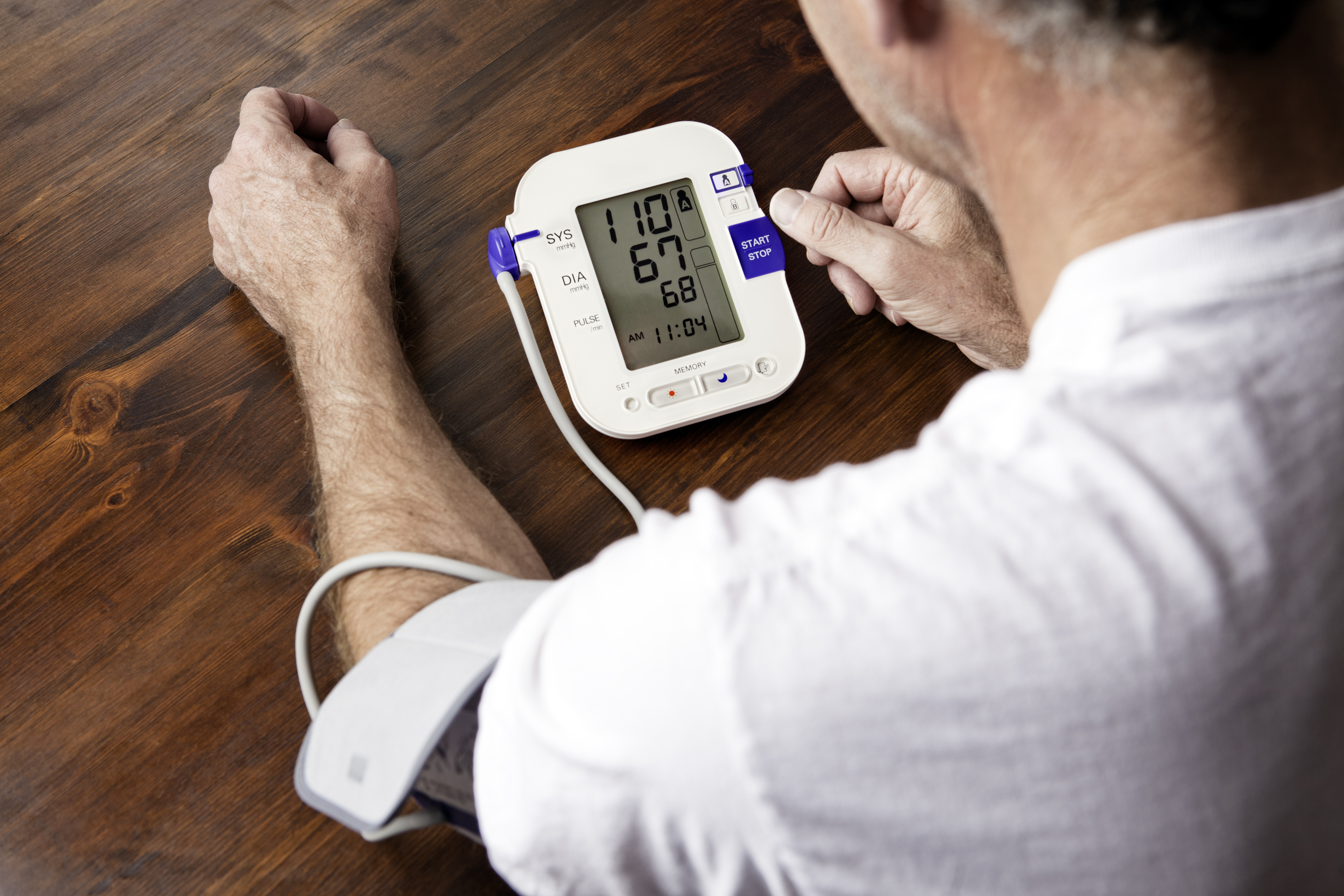 Mature adult man checking blood pressure