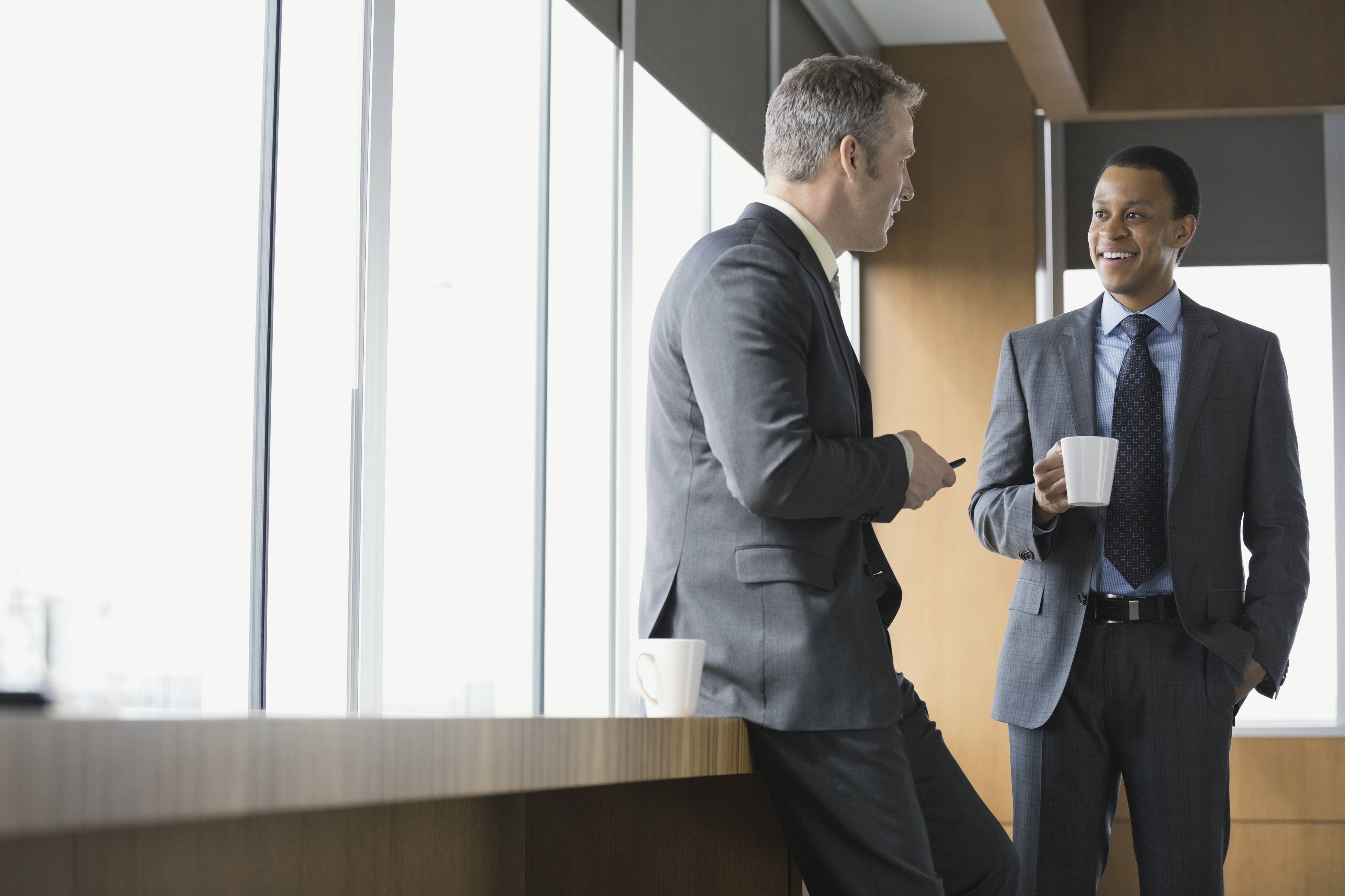 Businessmen talking in conference room