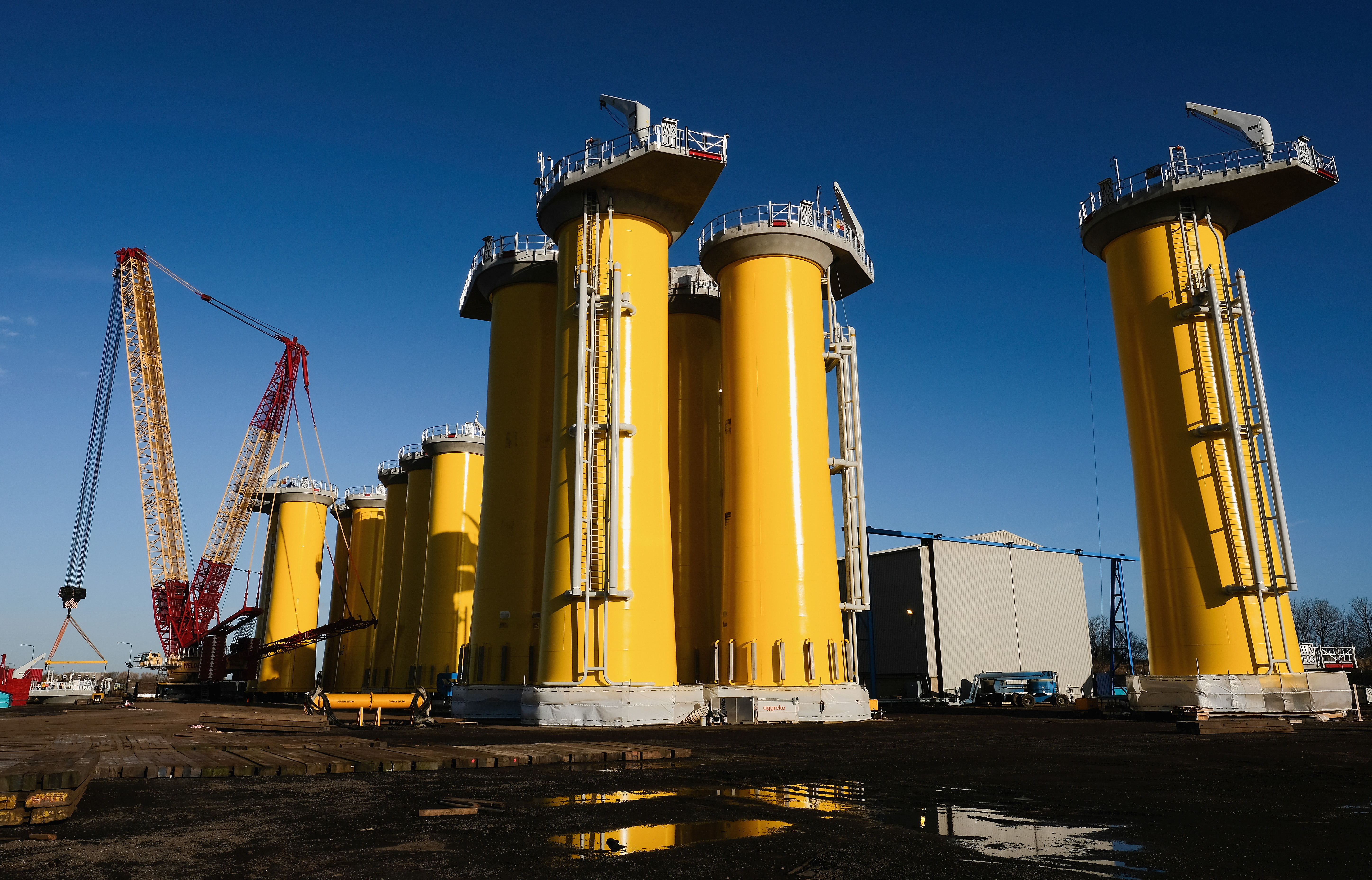 Wind Turbine Transition Pieces Lined Up For Transport