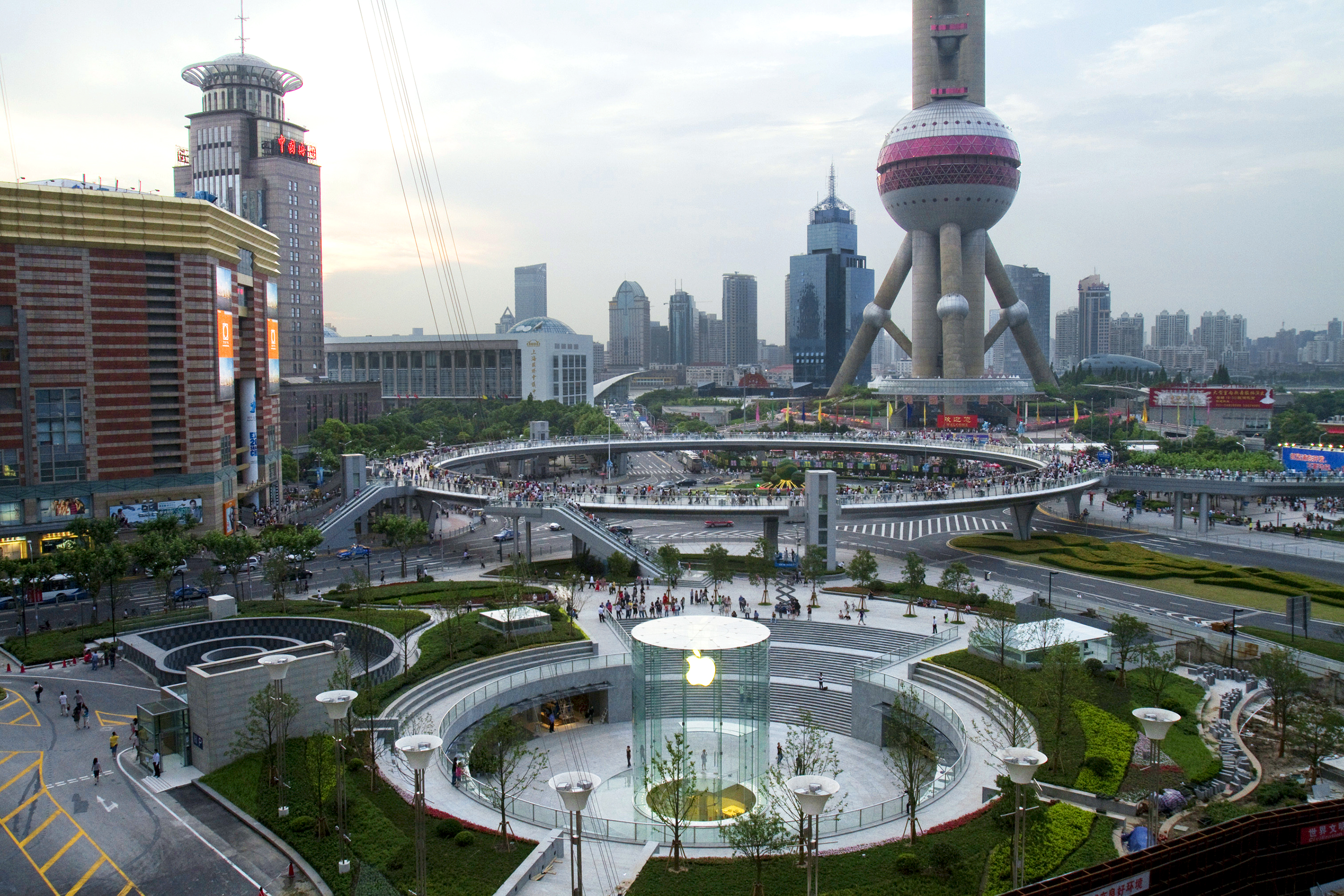 Apple's new flagship store stands in front of the Oriental Pearl Tower in Shanghai.
