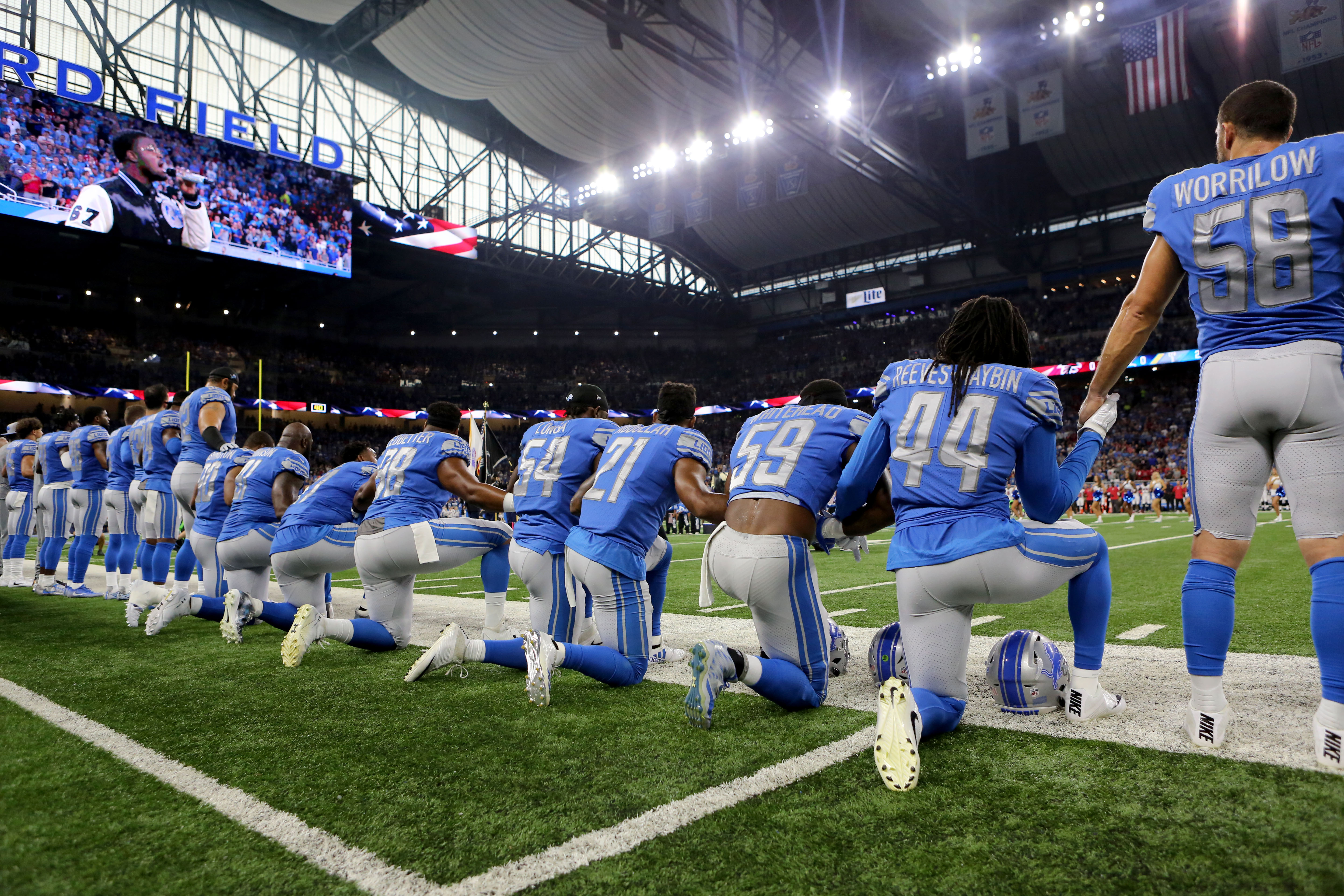 Members of the Detroit Lions take a knee during the playing of the national anthem prior to the start of the game against the Atlanta Falcons at Ford Field on September 24, 2017 in Detroit, Michigan.
