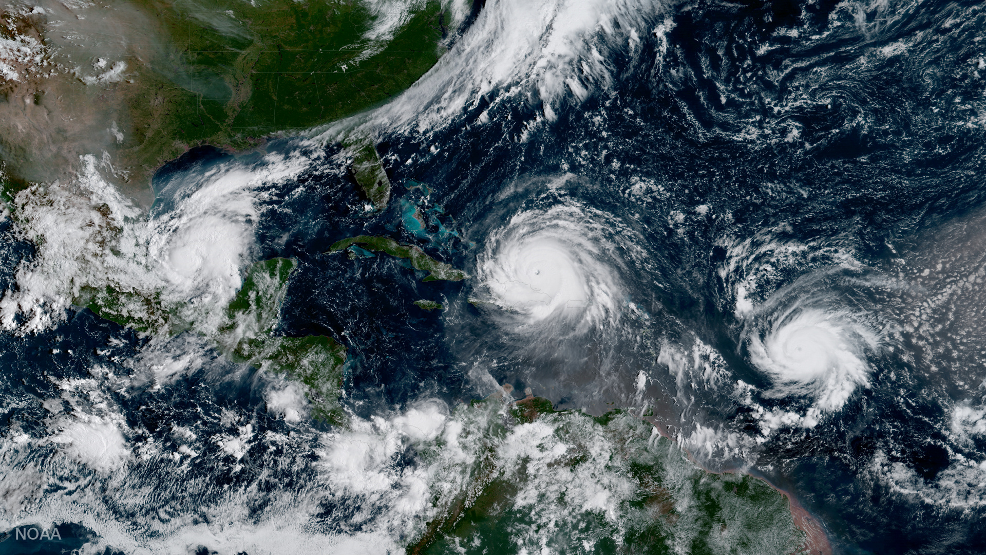 Hurricane Irma, Hurricane Jose and Hurricane Katia are pictured in the Atlantic Ocean in this NOAA satellite handout photo