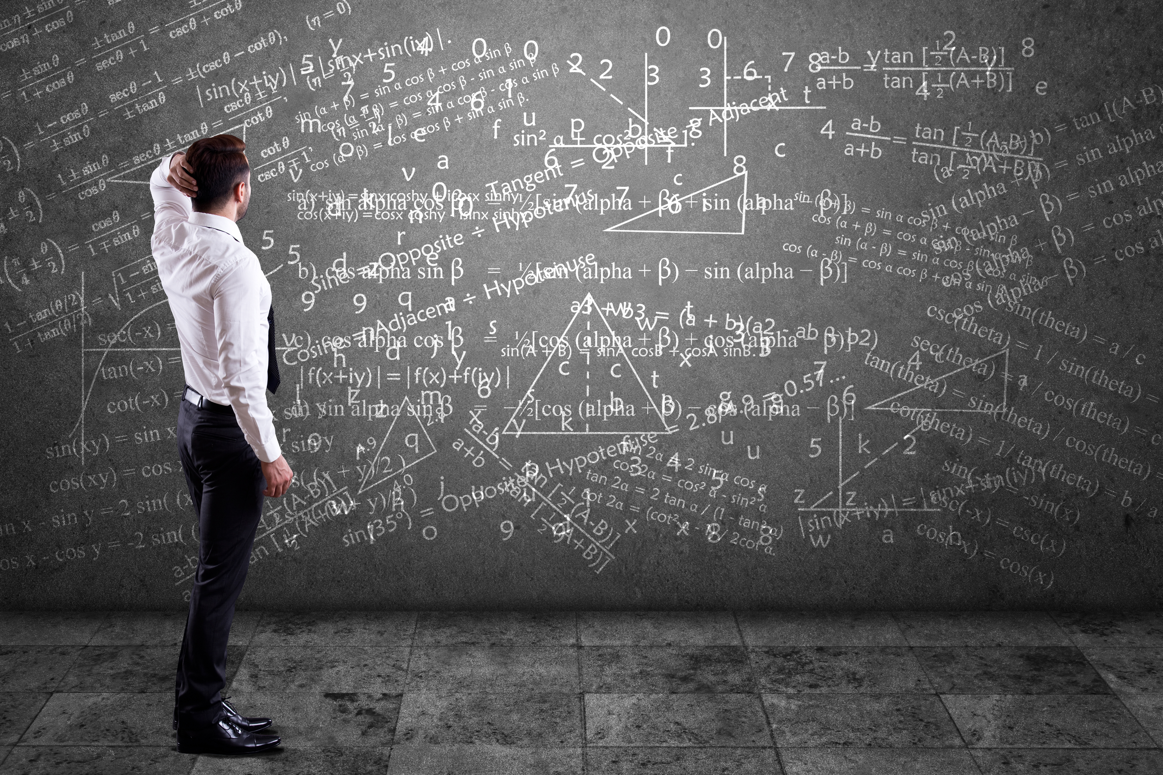Businessman solving mathematical equation