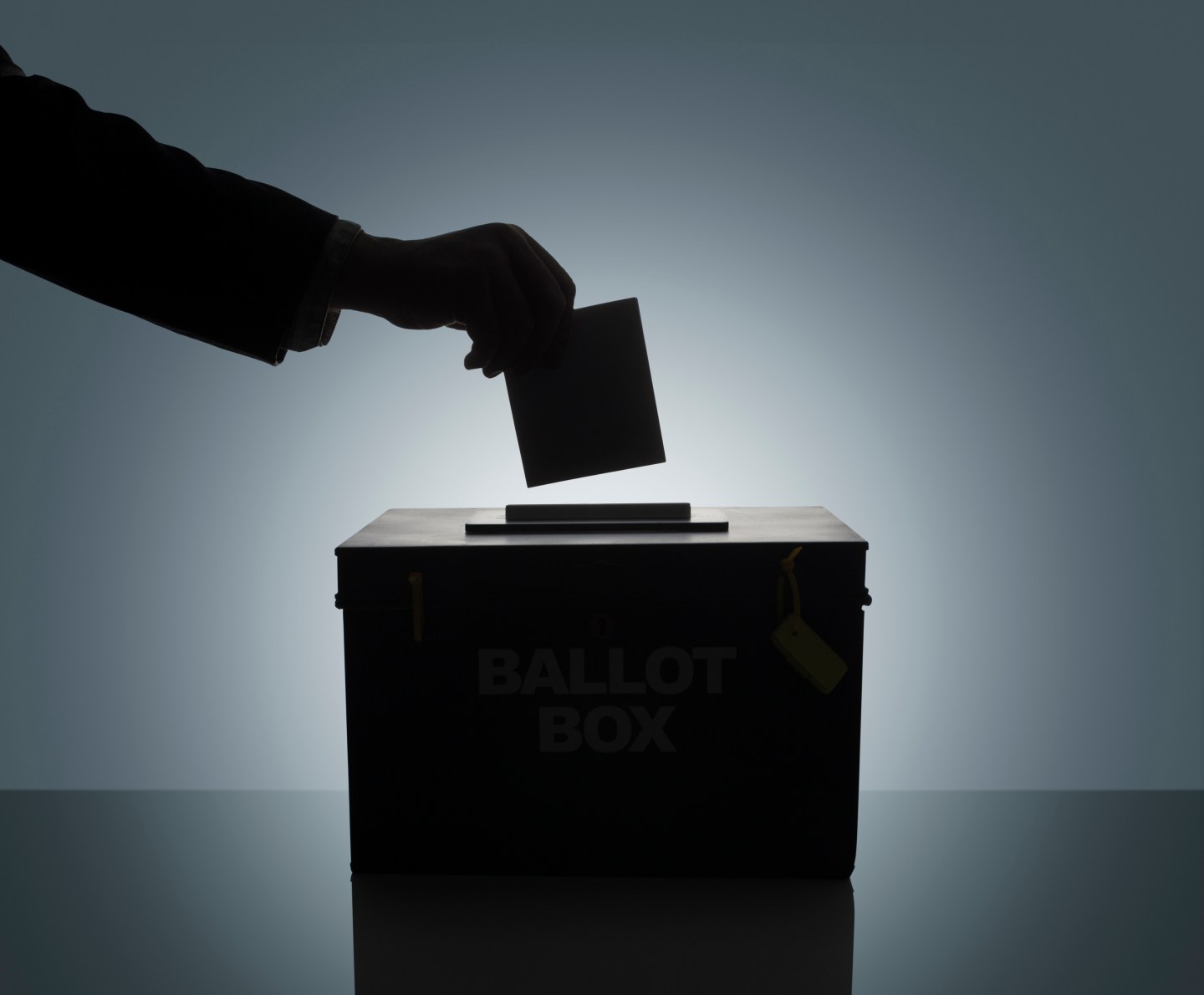 Silhouette of man casting his vote