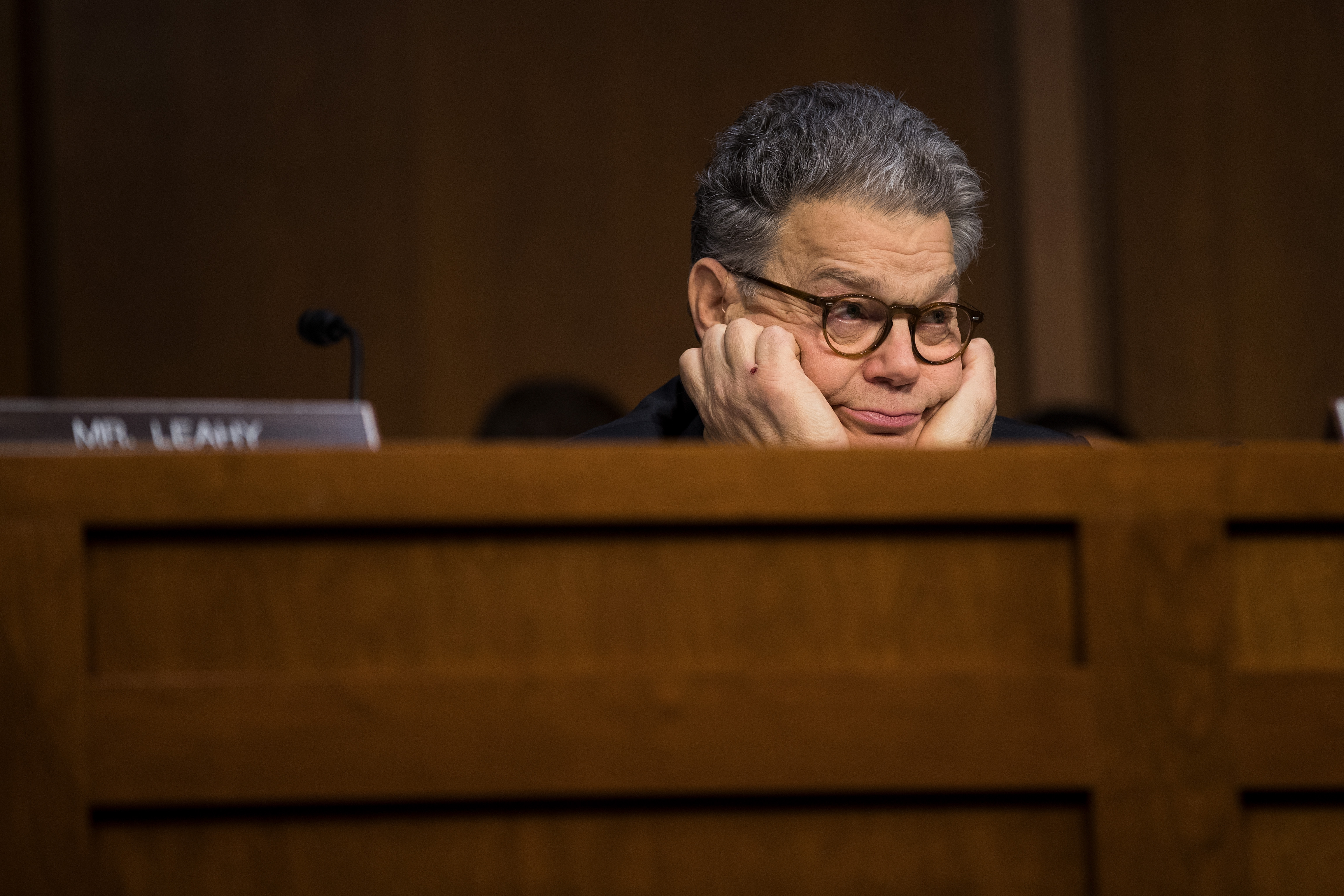 Al Franken looks bored in a Senate hearing with tech companies