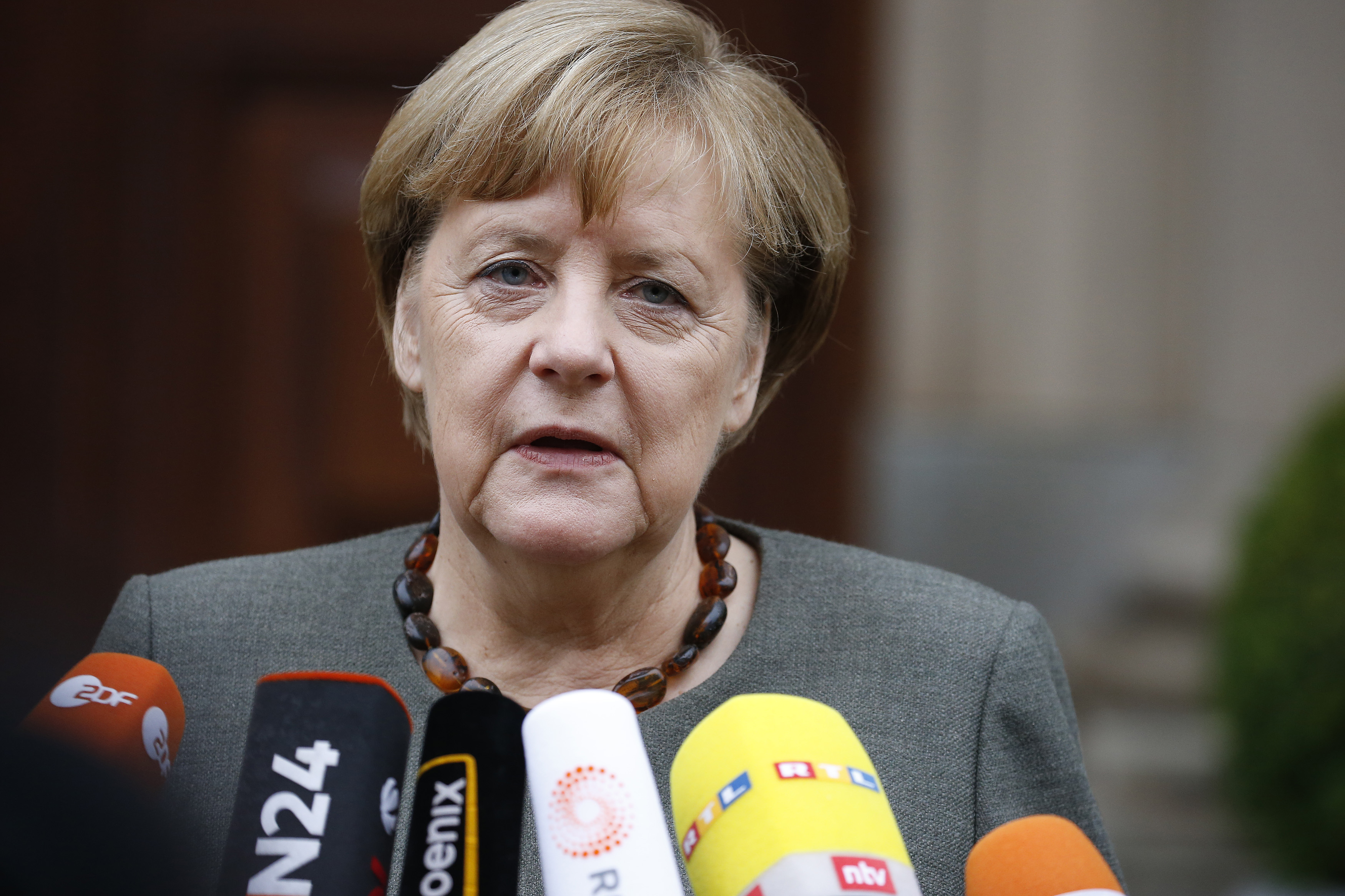 German Chancellor Merkel arrives for exploratory talks at the German Parliamentary Society about forming a new coalition government in Berlin