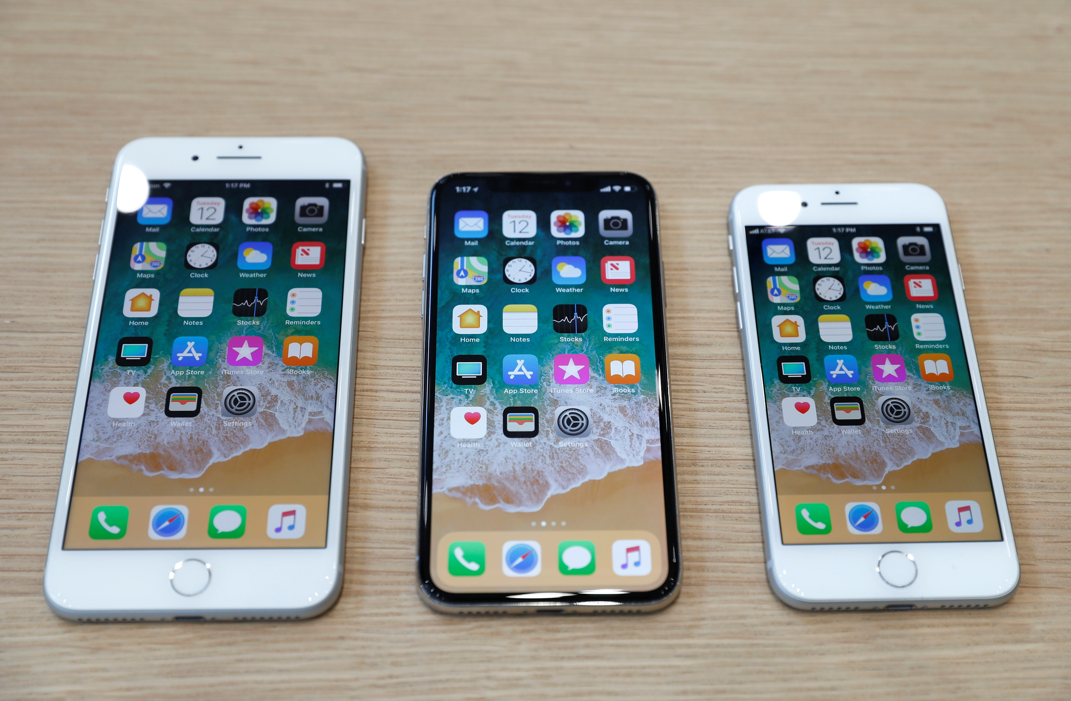 Different iPhone 8 models are displayed during an Apple launch event in Cupertino