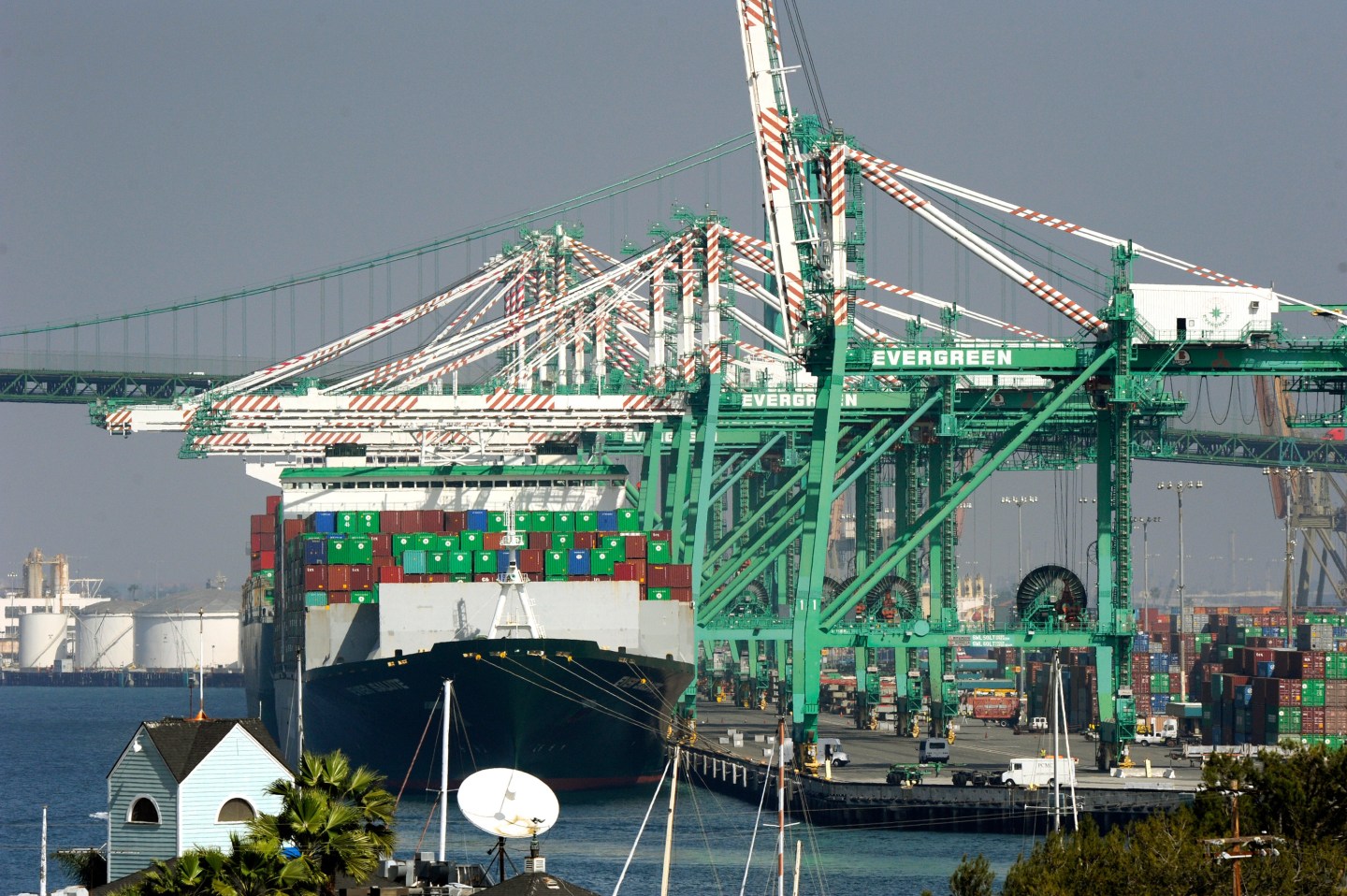Freighters and cargo containers sit idle at the Port of Los Angeles as a back-log of over 30 container ships sit anchored outside the Port in Los Angeles