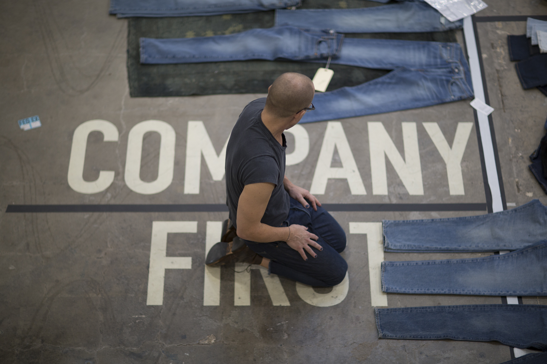Bart Sights, VP of technical innovation at Levi Strauss, inspects jeans on the floor of his Eureka Innovation Lab in San Francisco