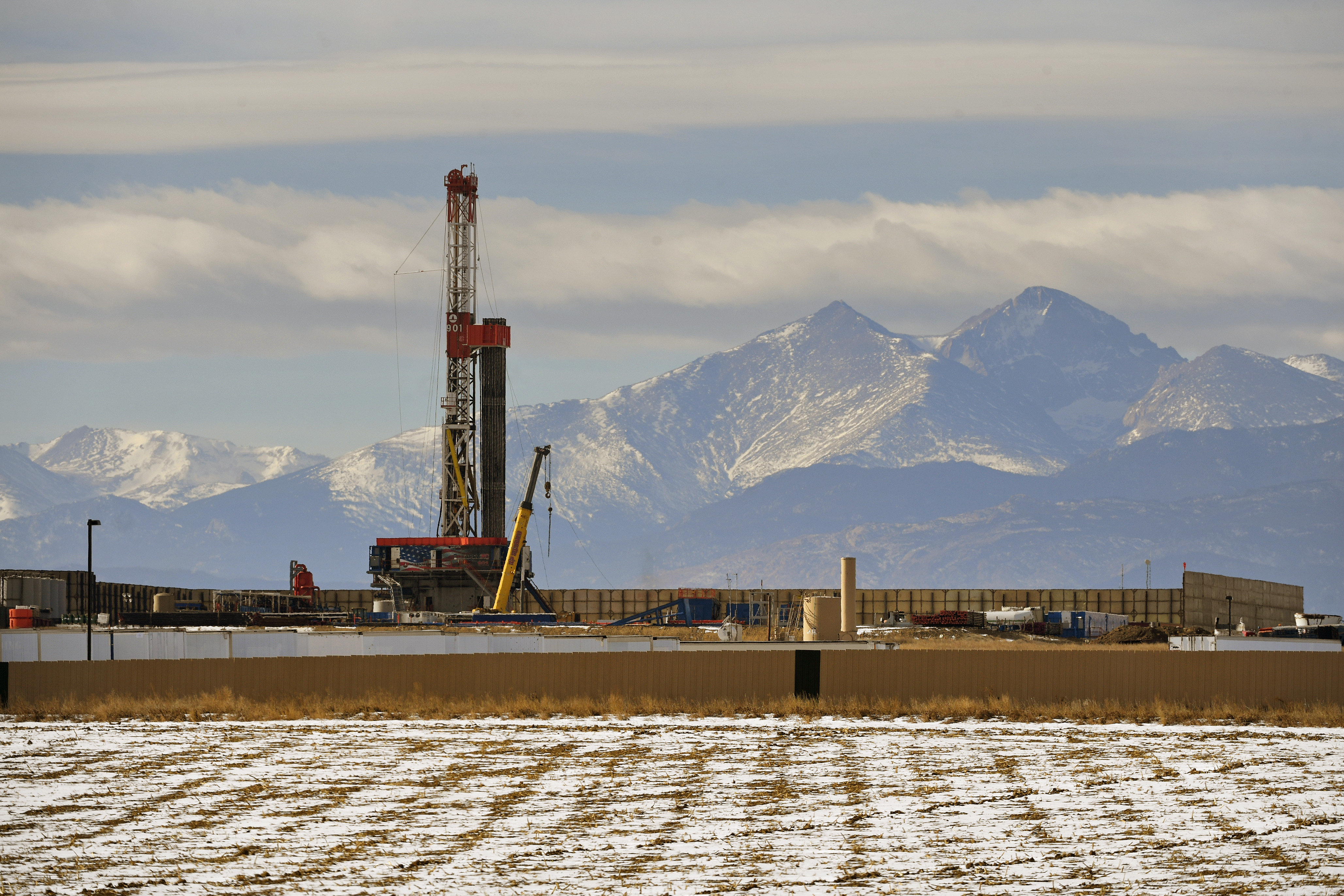 A large fracking operation with mountains looming in the background on December 28, 2017 in Loveland, Colorado.