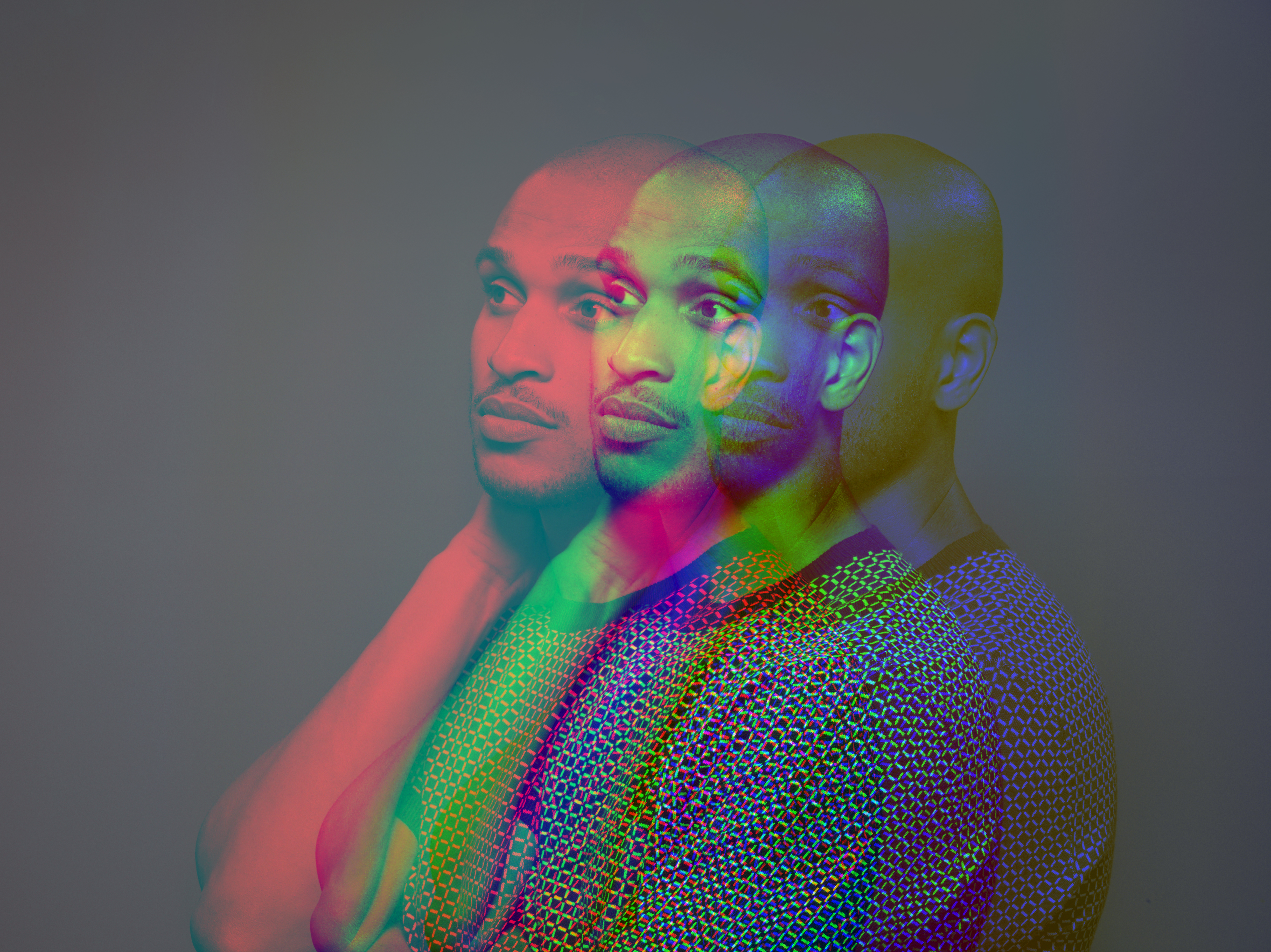 Multiple exposure, portrait of a dark skinned man who looks concerned
