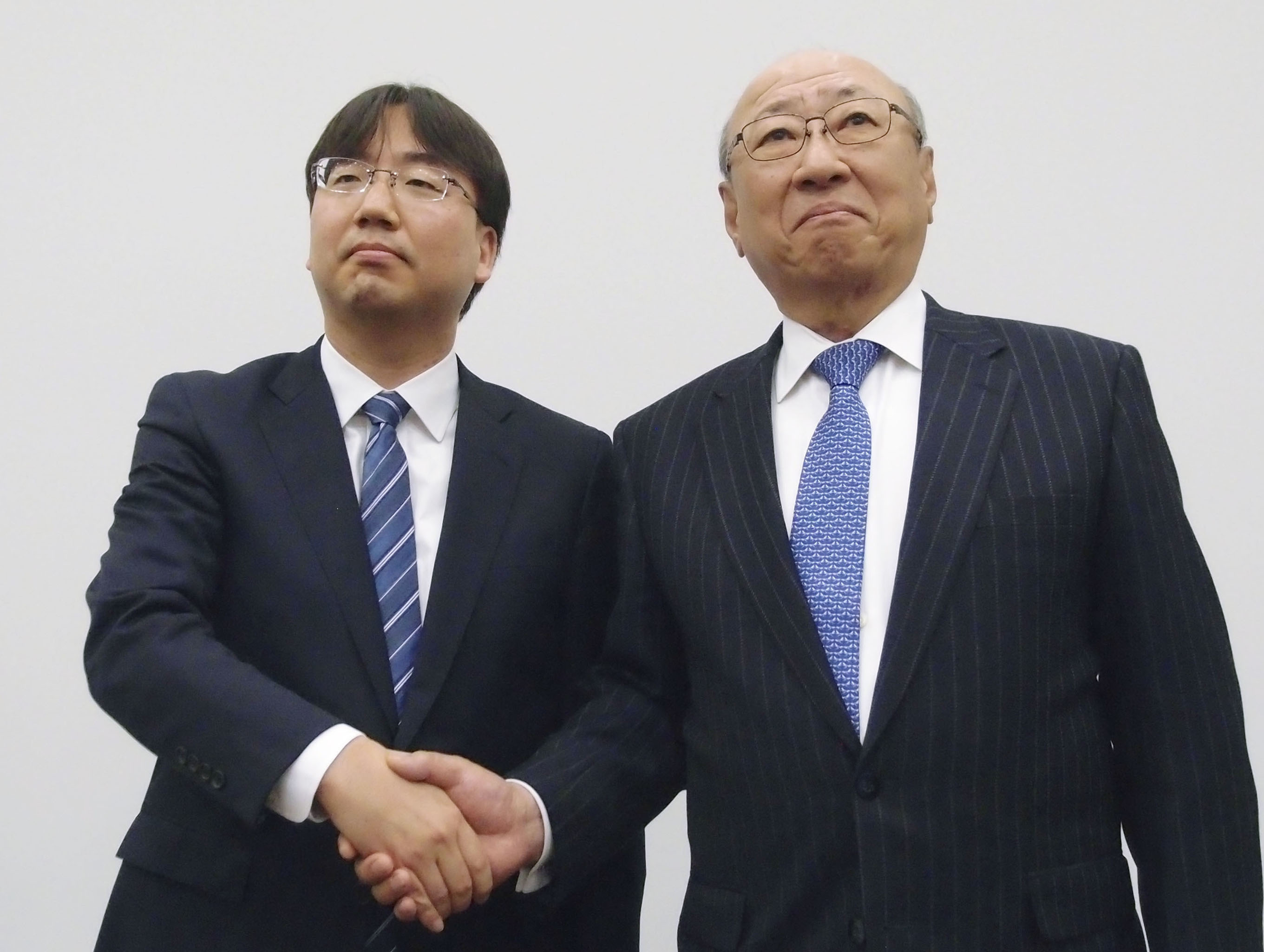 New Nintendo President Shuntaro Furukawa shakes hand with Tatsui Kimishima
