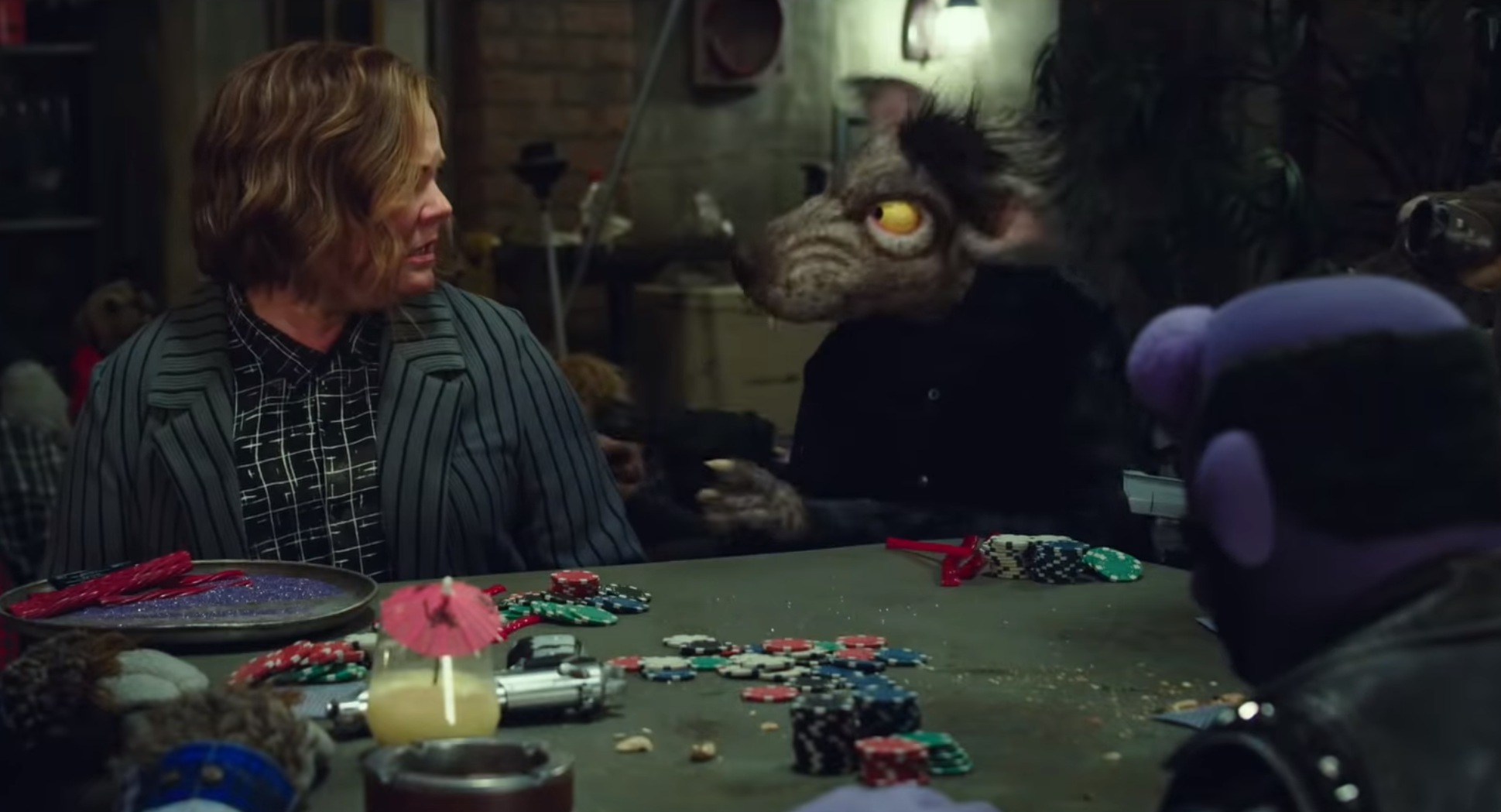 melissa mccarthy and puppet with gun