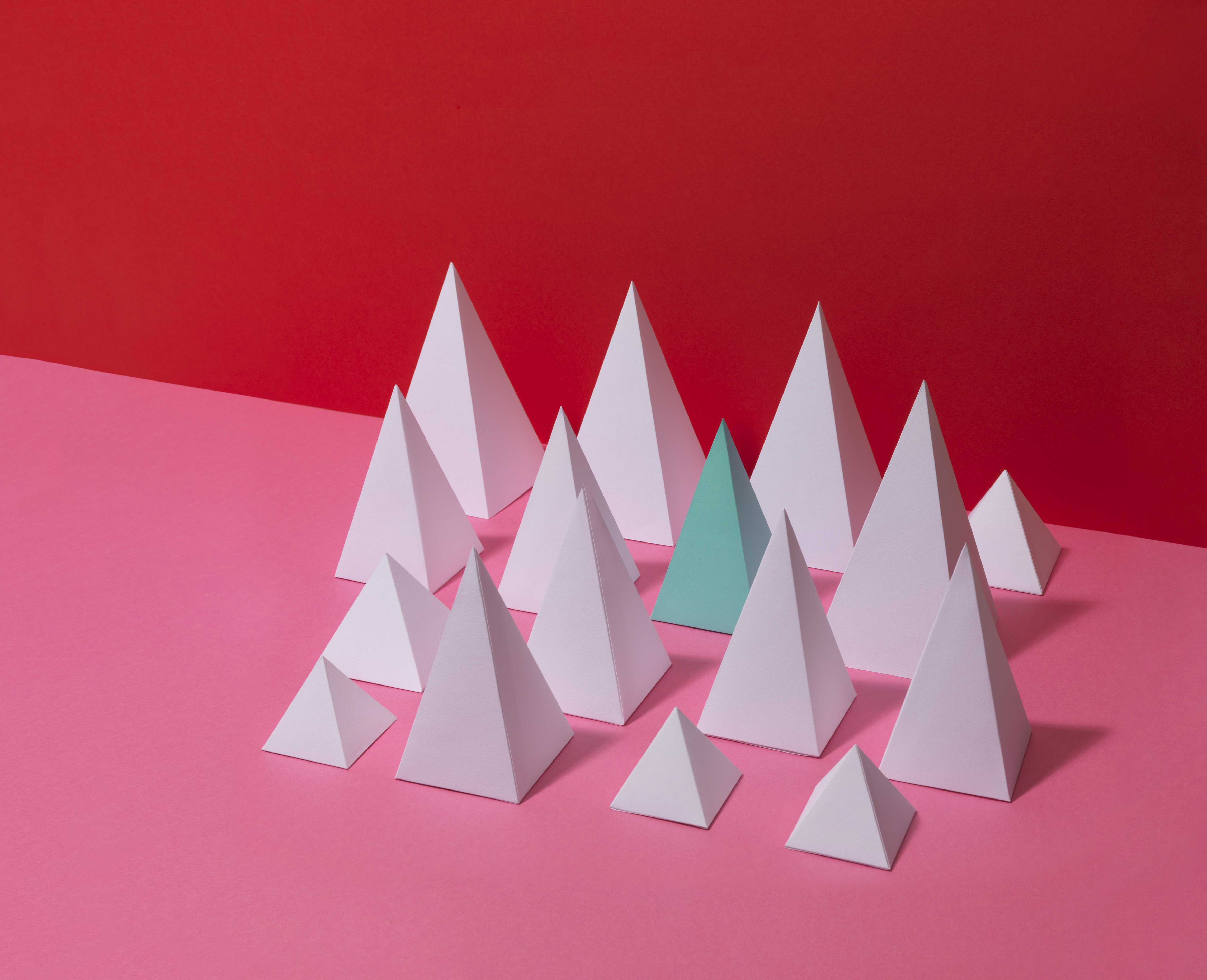 White Pyramids on Red Background