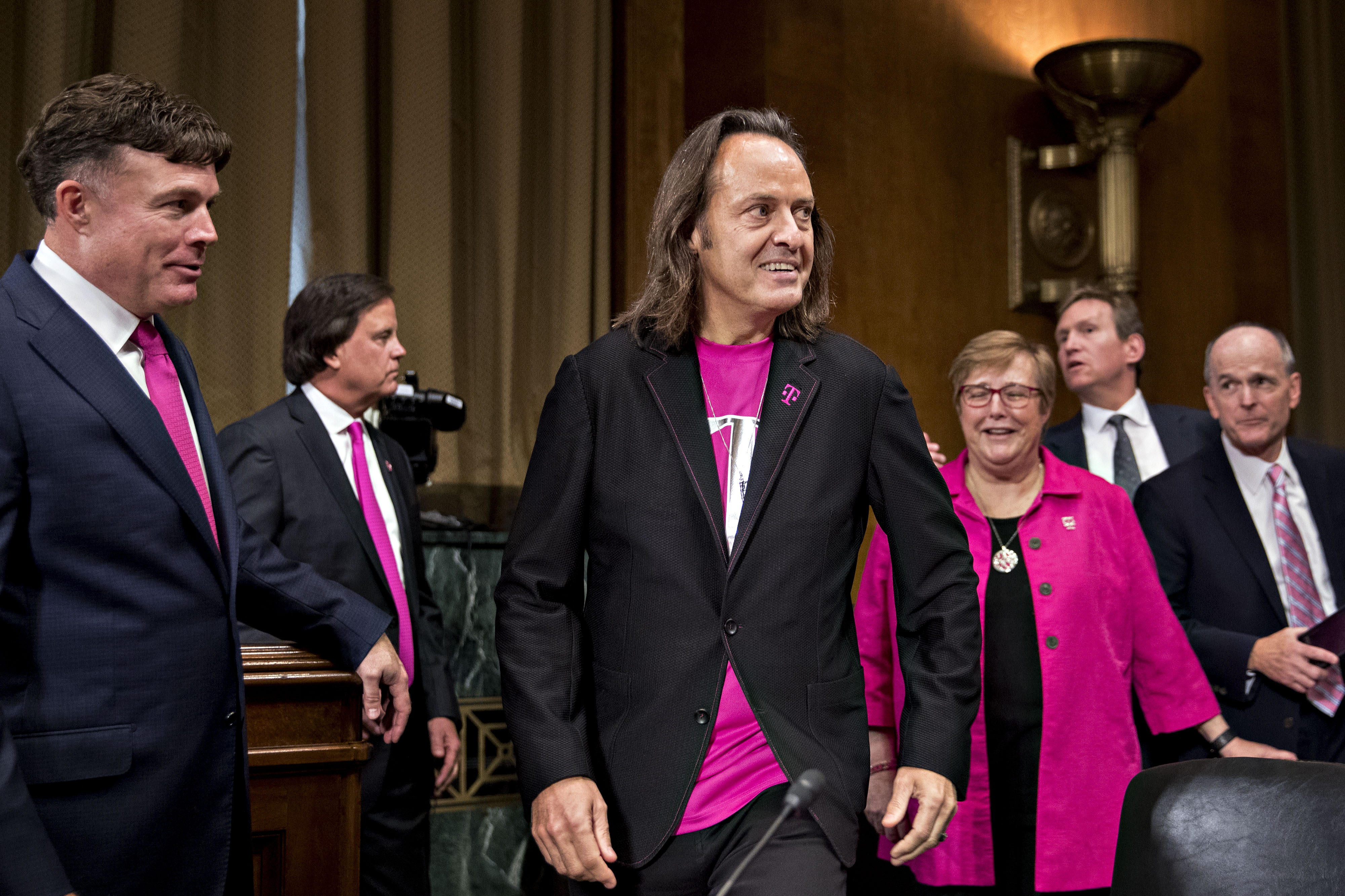 T-Mobile CEO John Legere arrives at a Senate hearing to testify about his proposed merger with Sprint.