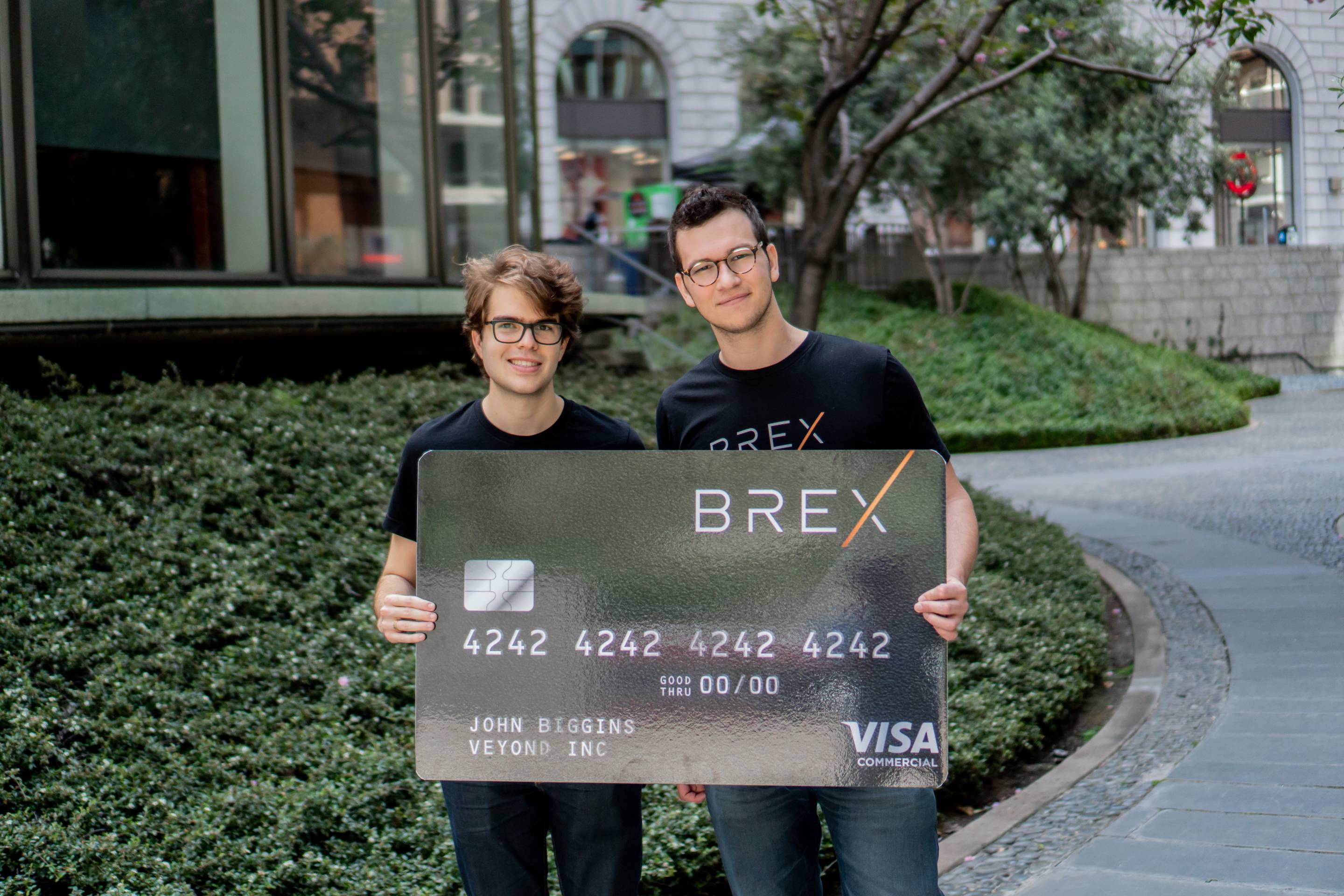 Brex cofounders Pedro Franceschi (left) and Henrique Dubugras, CEO, hold up an oversized version of the credit card they are providing to other startups.